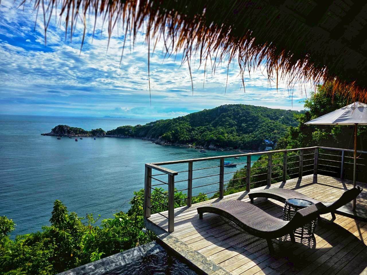 Private terrace with island view under thatched roof, Villa Pavana Koh Tao Thailand