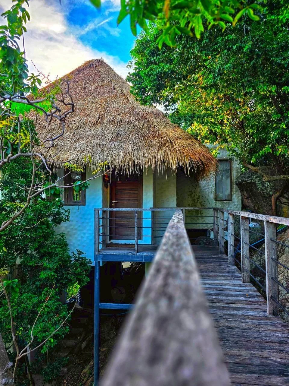 Wooden walkway through tropical jungle leading to Villa Pavana, Koh Tao Thailand
