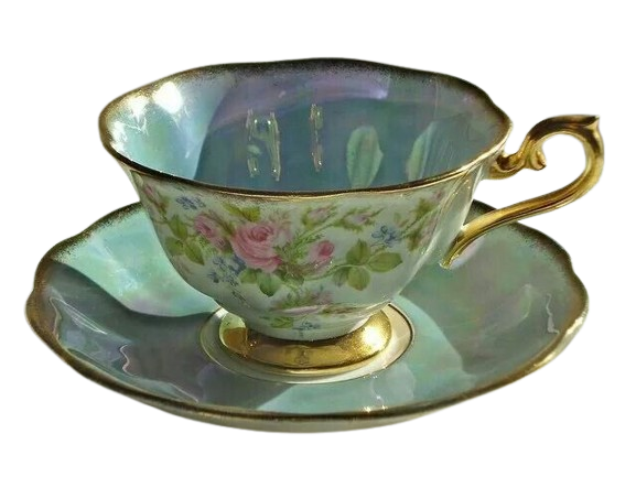 A vintage porcelain teacup with a floral pattern and gold trim, placed on a matching saucer.