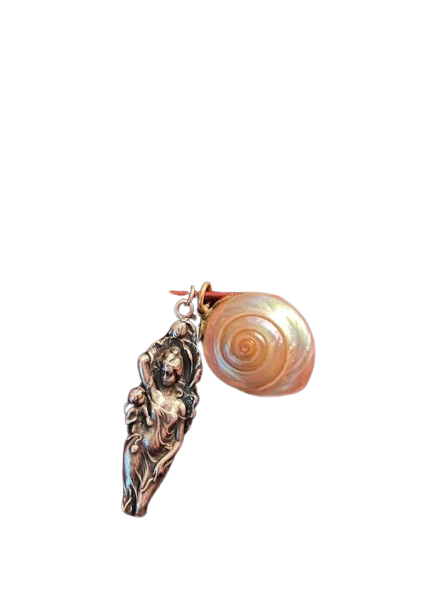 A jewelry pendant featuring a detailed silver figure and a spiraled shell charm against a black background.