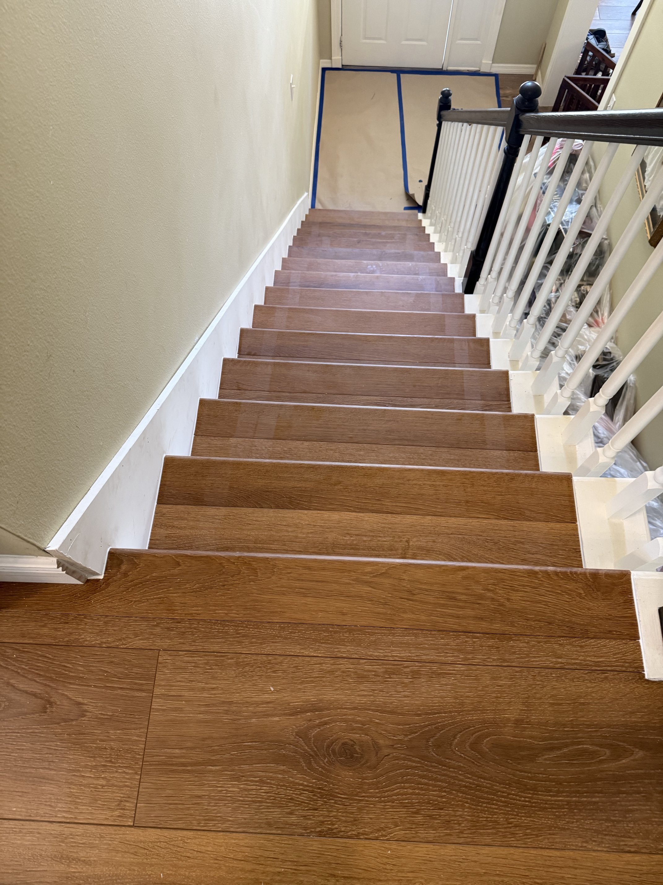 Full hallway and entryway view showing seamless LVP flooring throughout Dade City remodel