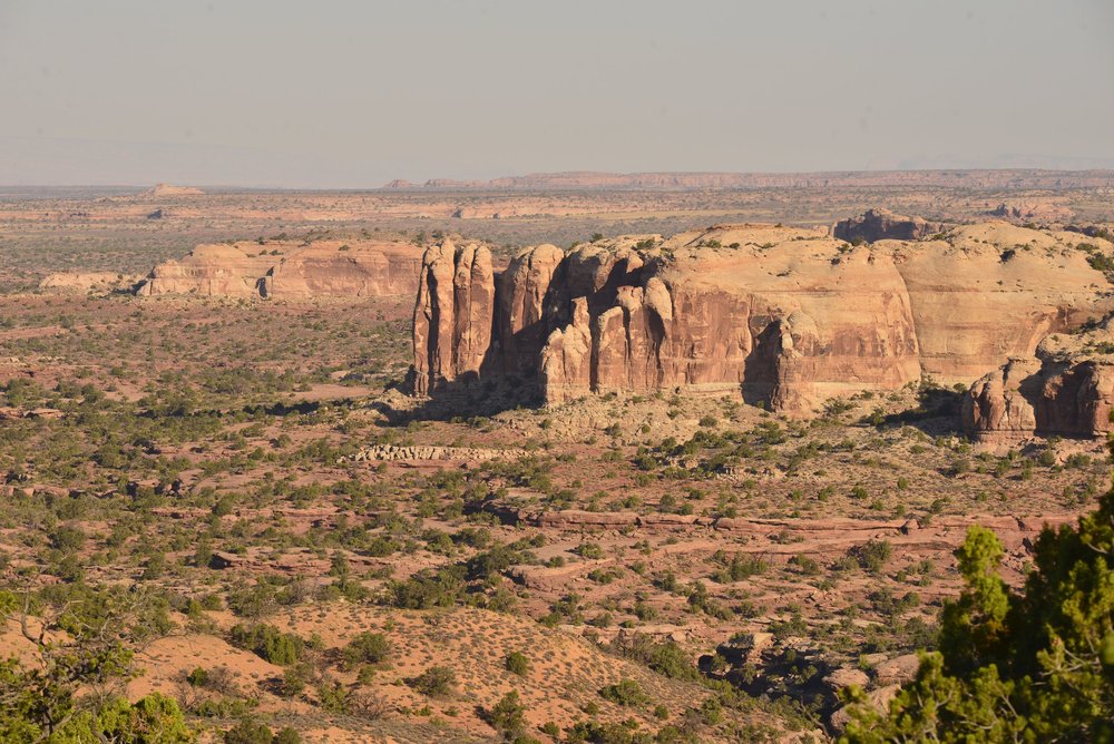 Massive Rock Formation Surrounded By Desert.JPG