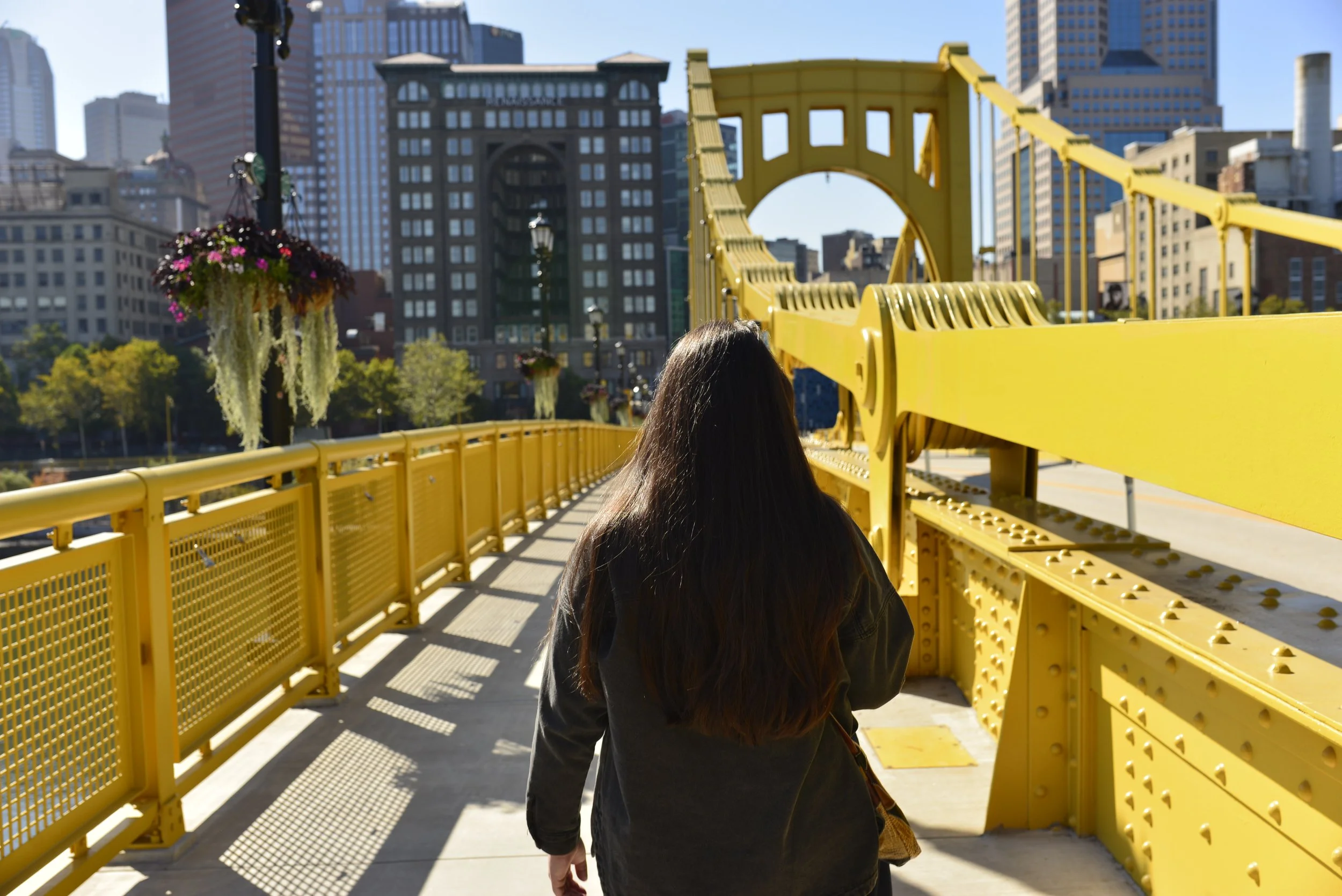Crossing the city on foot, steel underfoot and downtown straight ahead.