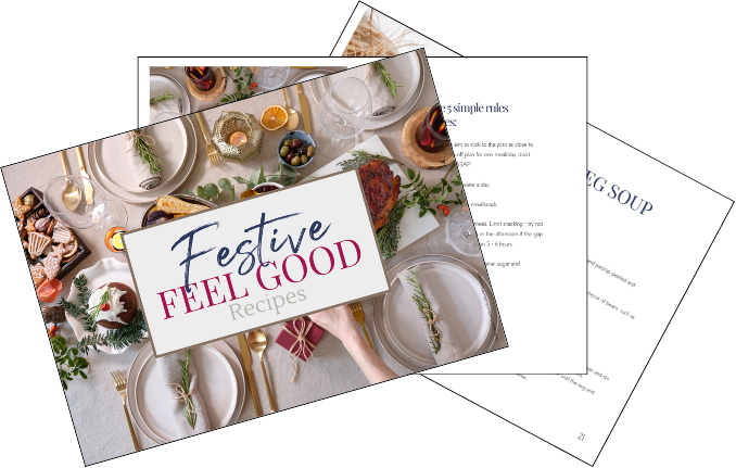 Cover of a holiday recipe booklet titled "Festive Feel Good Recipes" featuring a table setting with ornaments, food, and decorations for a festive celebration.