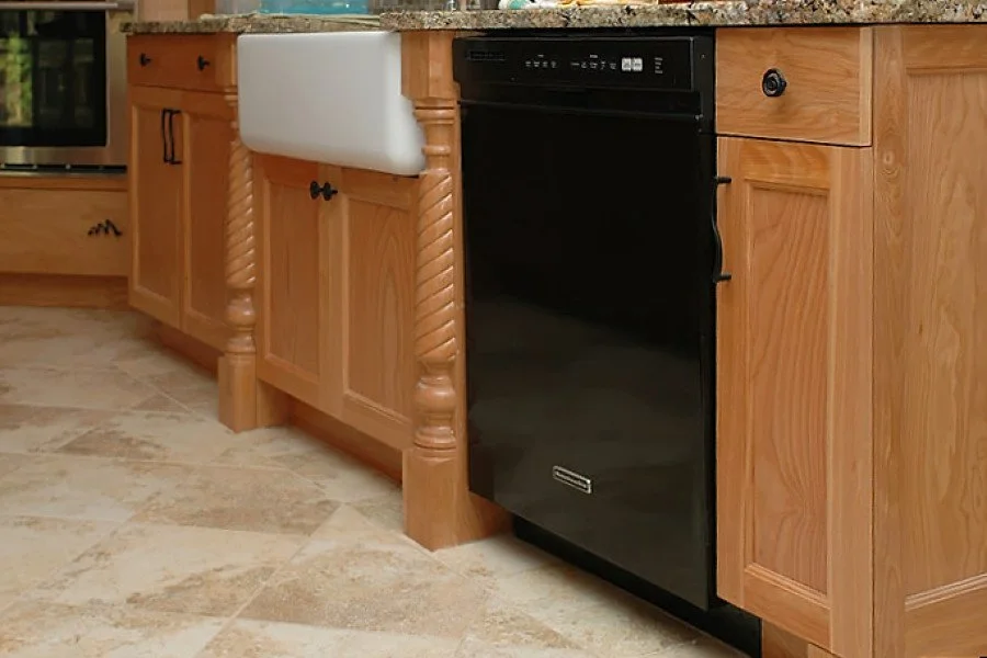 Kitchen with wooden cabinets, a black dishwasher, granite countertop, and a white farmhouse sink.