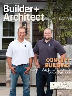 Two men standing outside in front of a house, smiling. One is wearing a white shirt and jeans, and the other is in a dark polo shirt. The house has large windows and some greenery nearby.