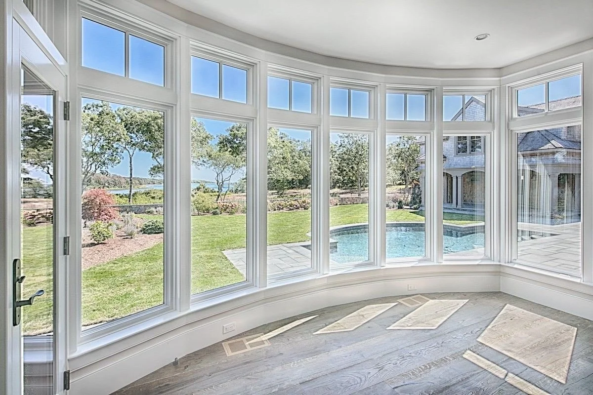 curved glass window wall.jpeg