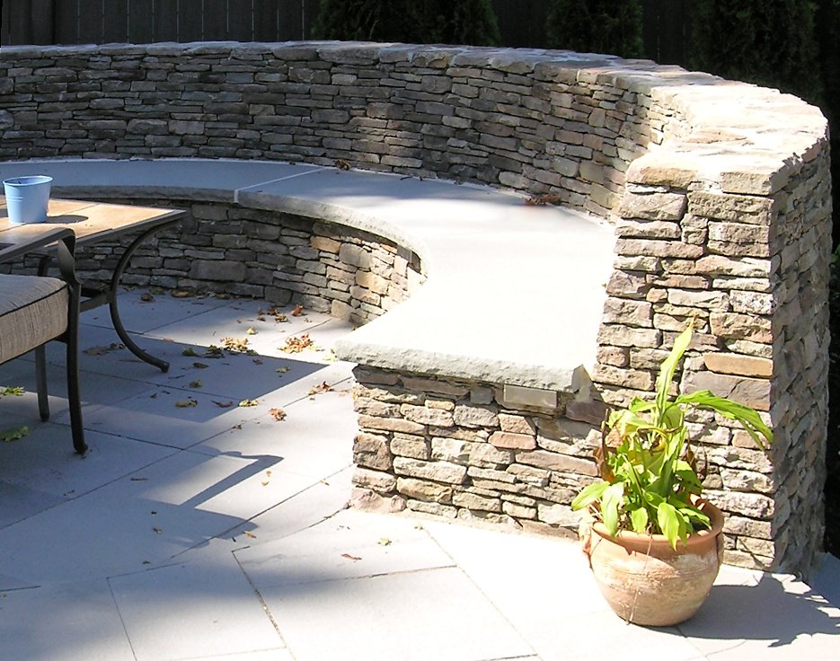 semi-circular stone patio bench.jpg