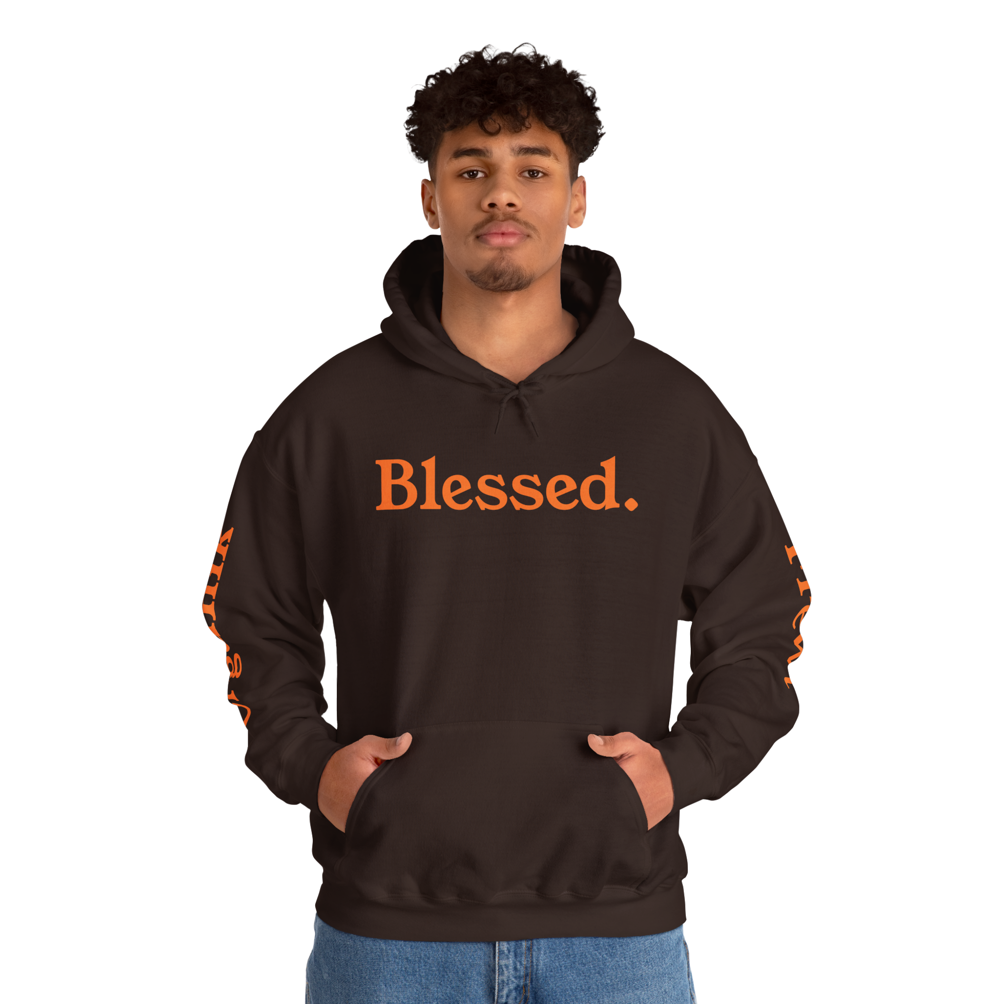 Man wearing a brown hoodie with "Blessed" in deep orange with brown undertone lettering, hands in pockets and "Organik" printed in deep orange with brown undertone on one sleeve and "Frewt" on the other.
