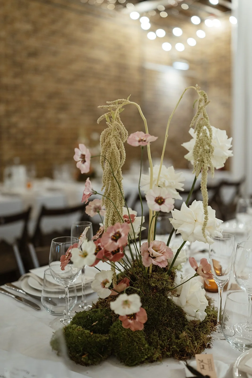modern flower installation, moss, centrepiece