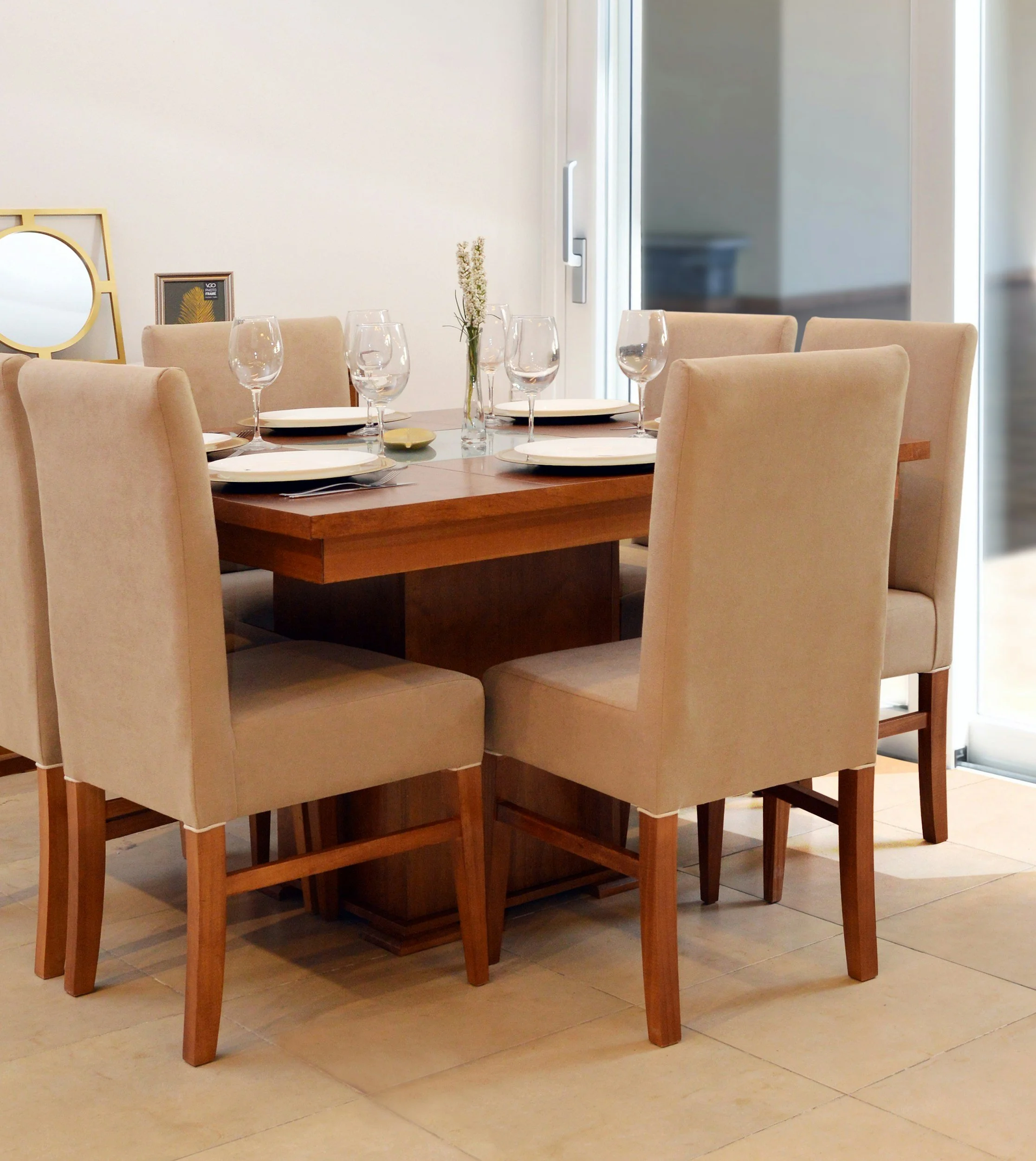 Dining chair set around an oak table in a warmly lit room