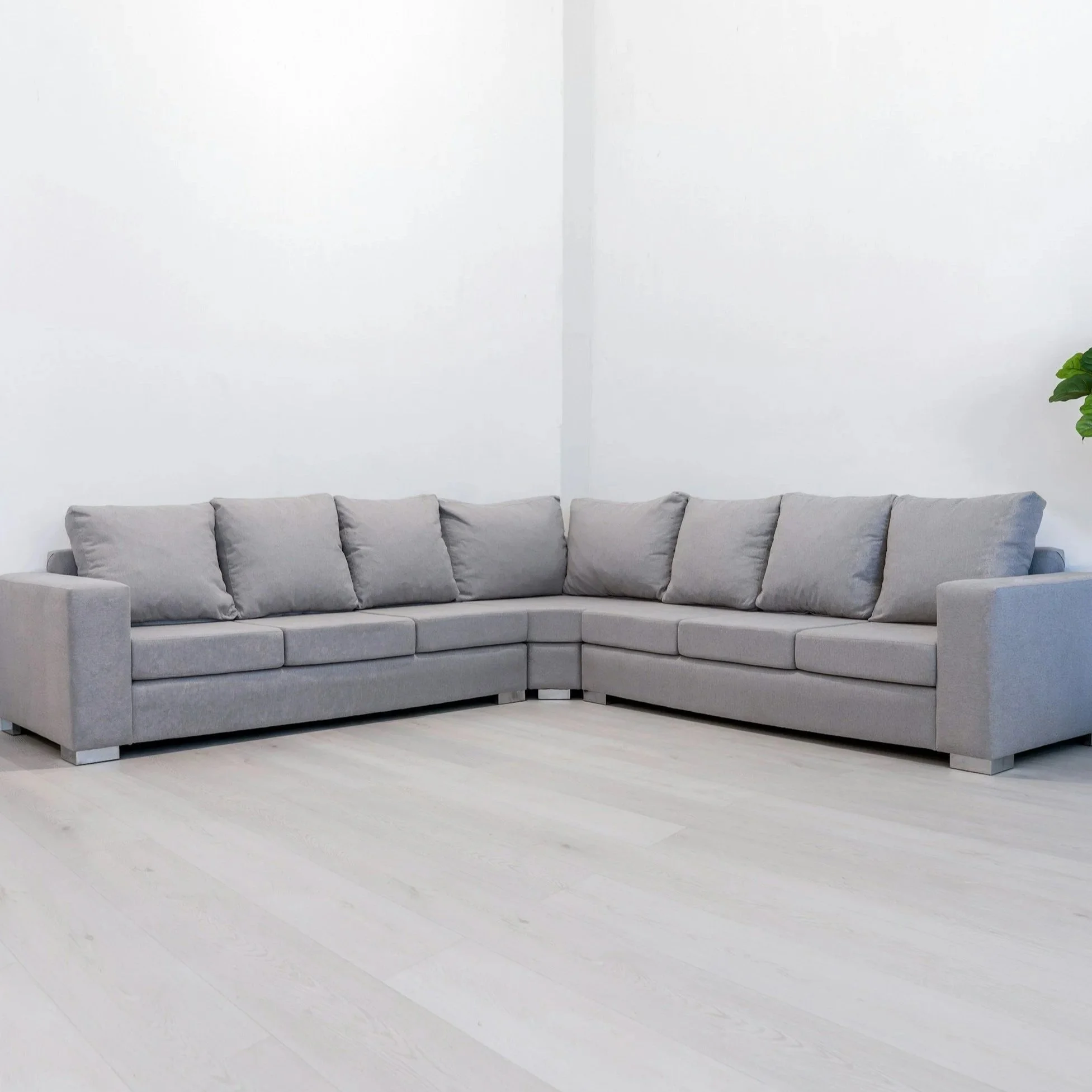 Large grey L-shaped sectional in minimalist environment