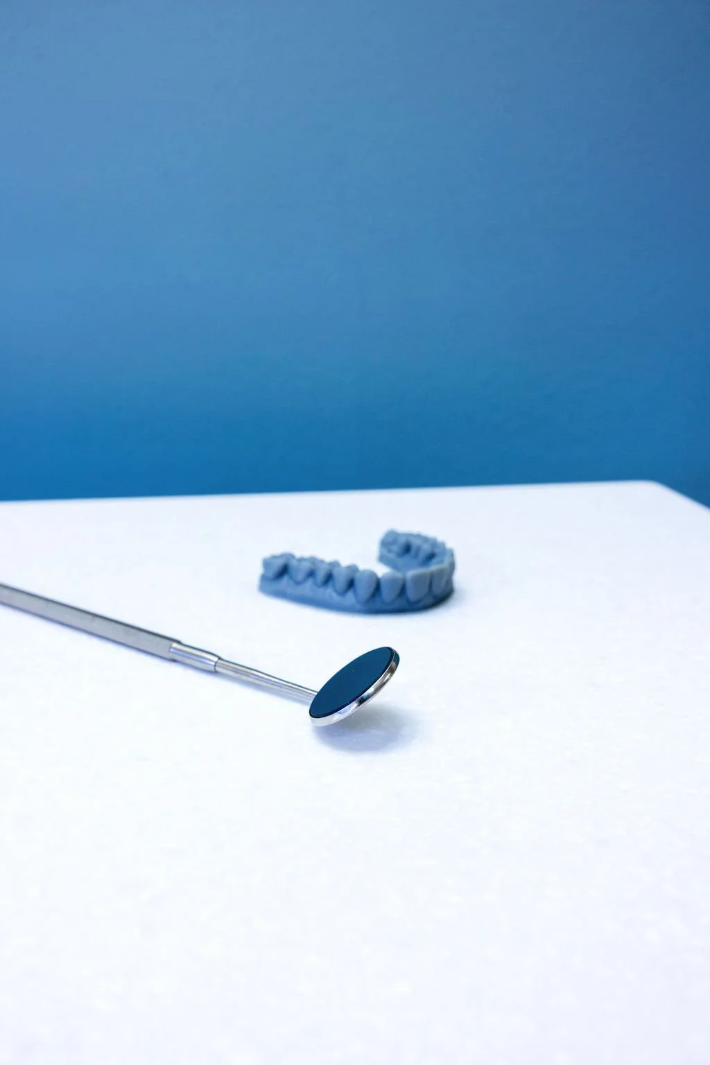 Orthodontic tools and a dental model used for treatment planning, representing the behind-the-scenes work included in braces pricing