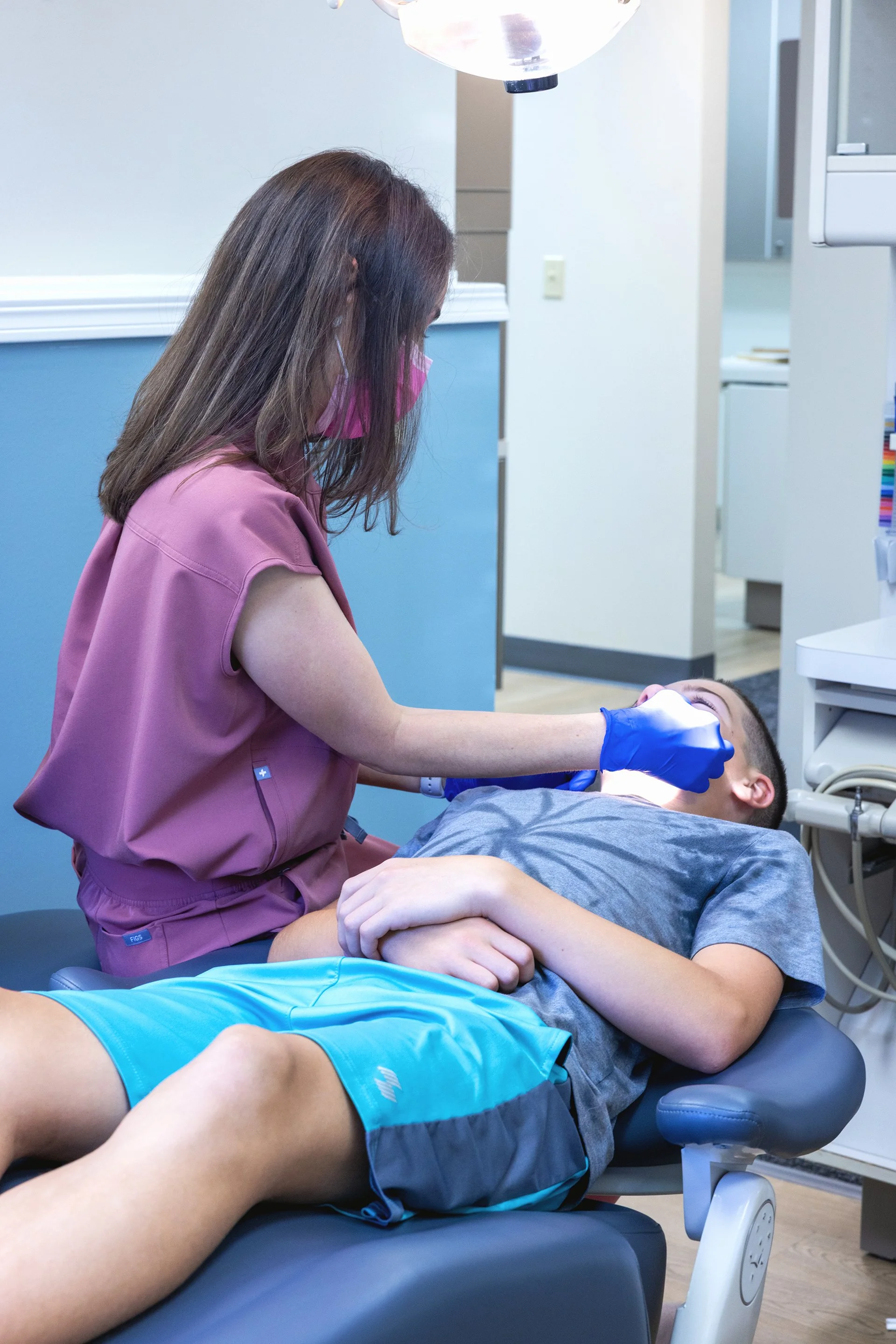 Dr. Kristen Sander checking clear aligner fit with a patient at Sander Orthodontic Arts in Andover, KS