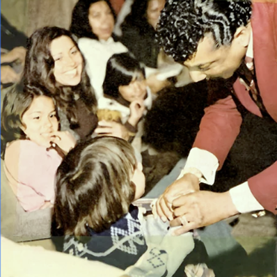 Reverend Ike visiting children C. 1976.