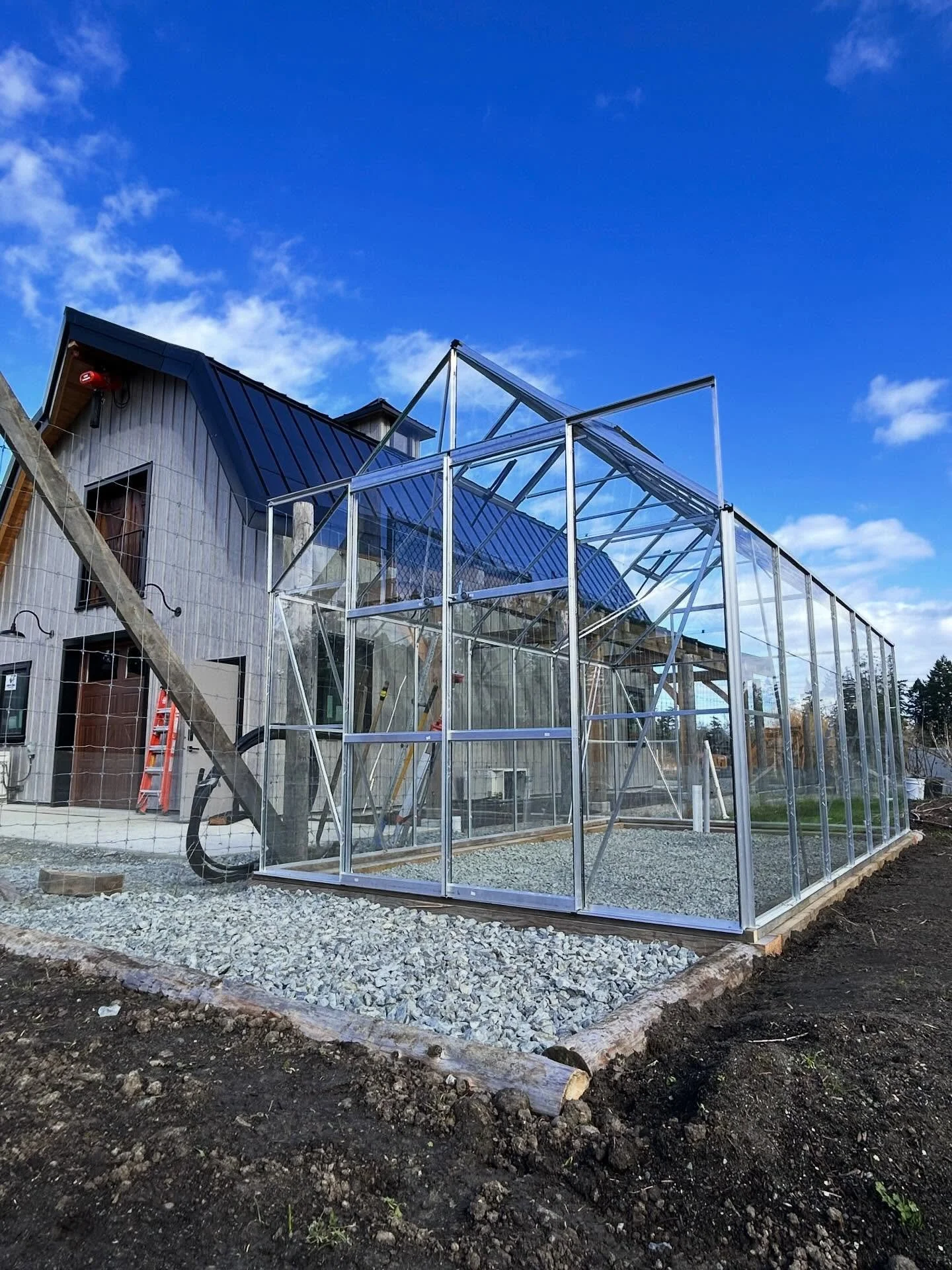 It&rsquo;s been a season of steady effort getting ready for our second year of production. Here&rsquo;s the new greenhouse (with a sneak peek of our gorgeous new barn 😍) #organic #farm #farmlife #organicfood #organicfarming