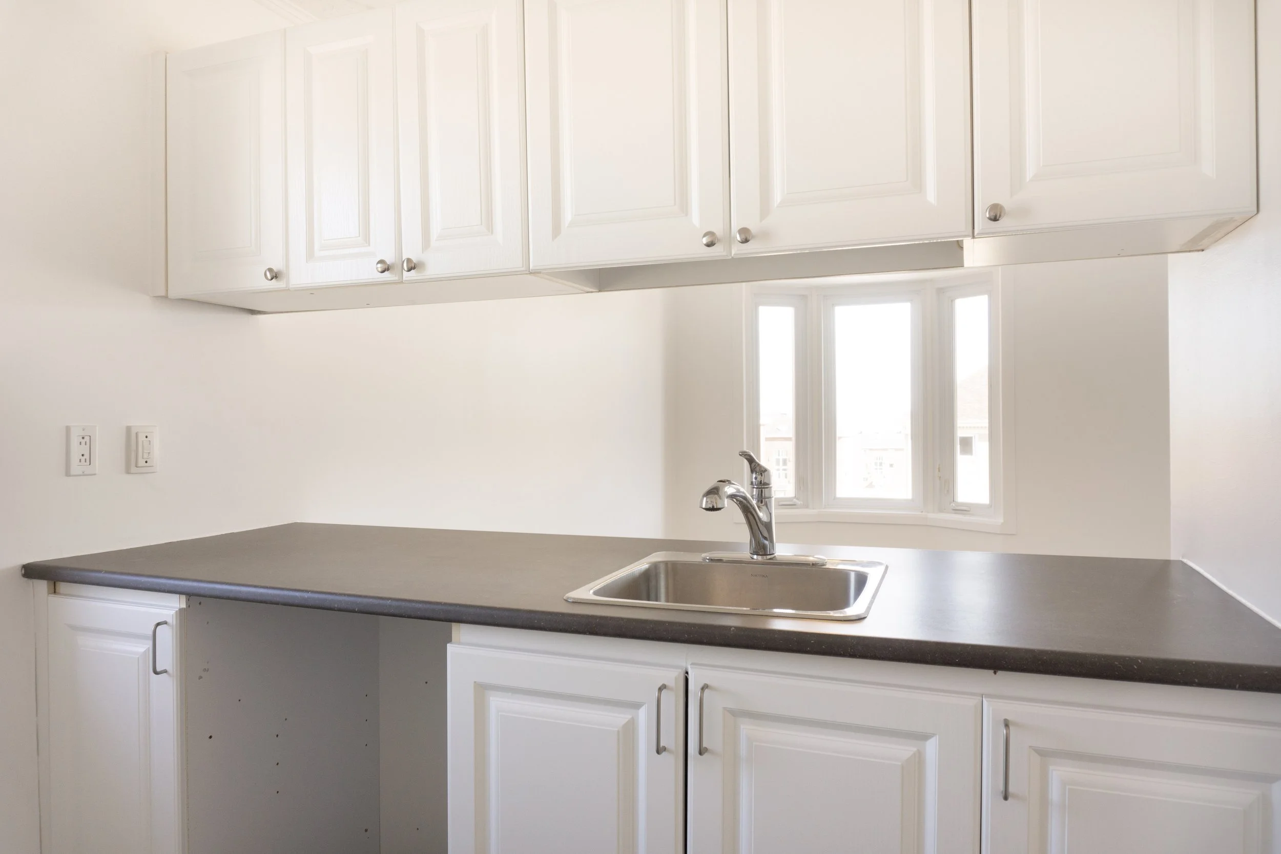 Photo immobilière; cuisine à l'intérieur d'un appartement à Québec