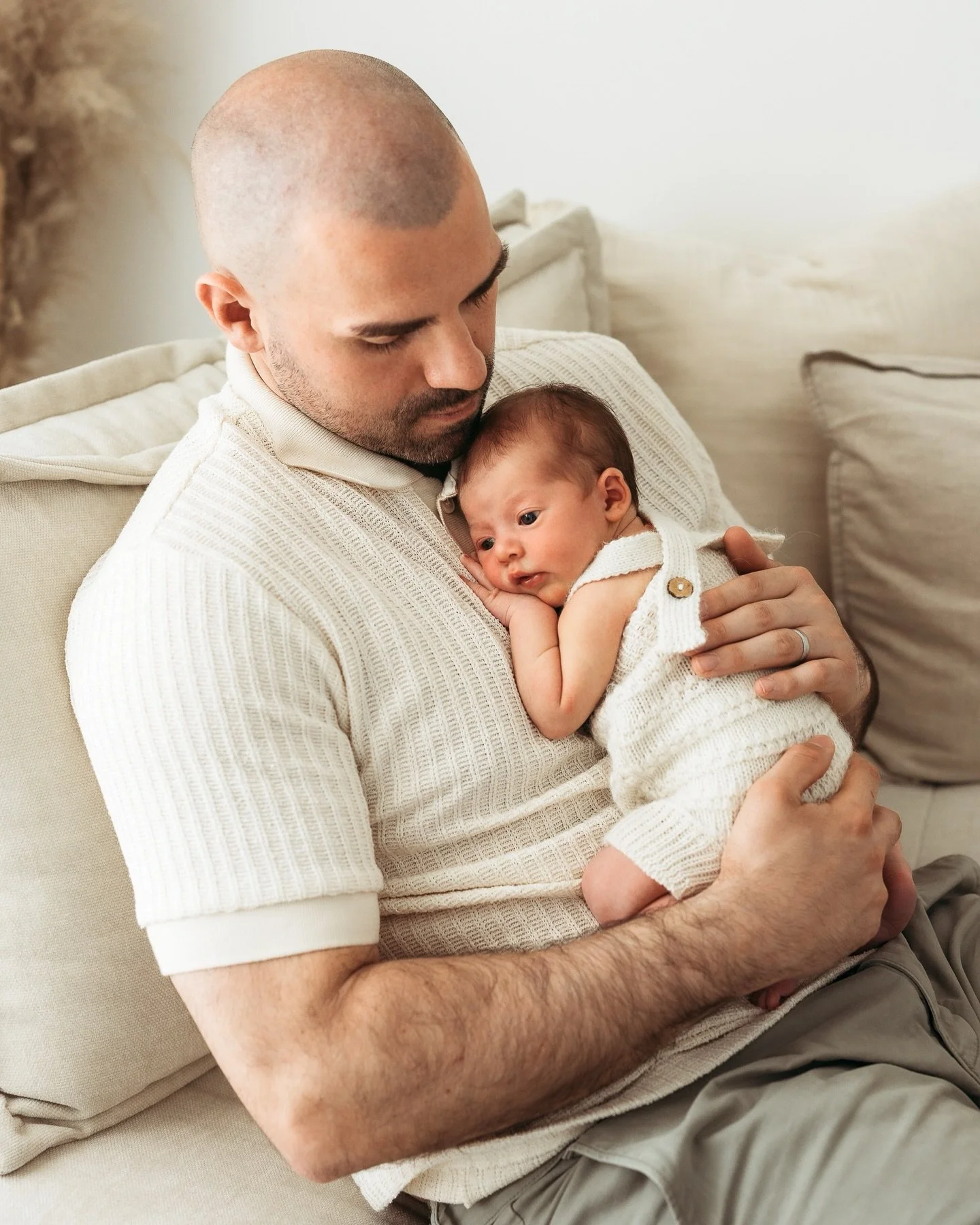 Newborn sessions with me are slow, cosy, and completely pressure free. You don&rsquo;t need a perfectly settled baby, perfectly behaved siblings, or even a dog who sits still for more than two seconds. We&rsquo;ll just take our time, you snuggle your
