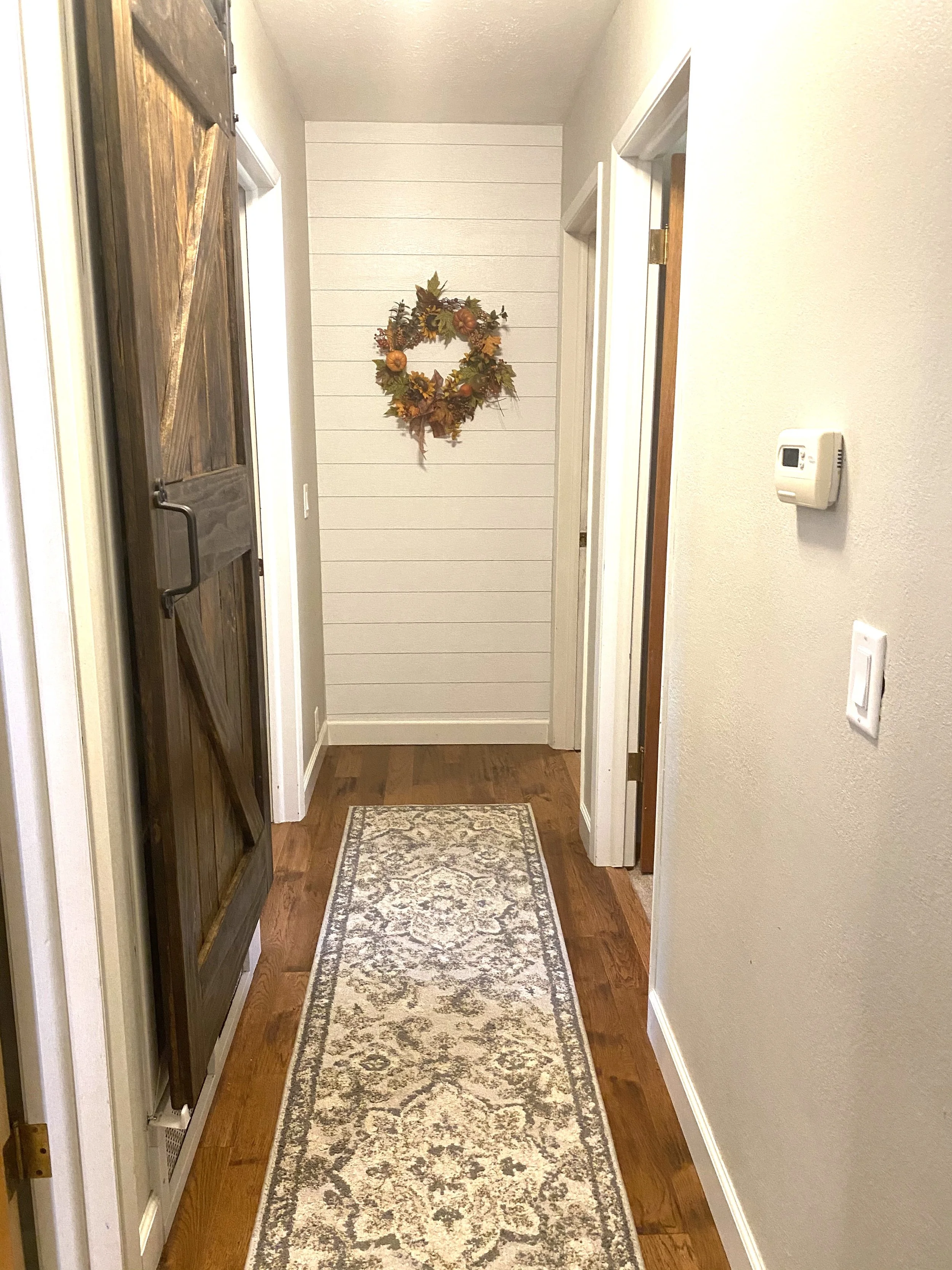 Custom built barn door, ship lap and paint to freshen up this home. 