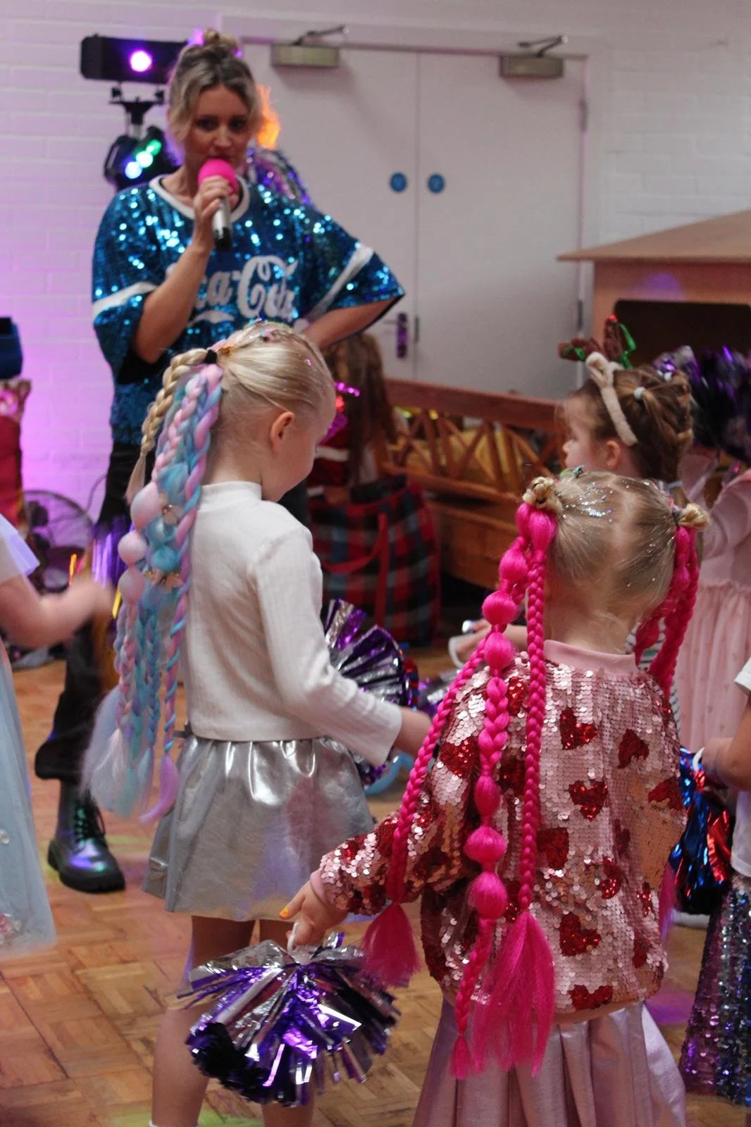 “Children’s party hair braiding with colourful extensions at an event in Wandsworth.”