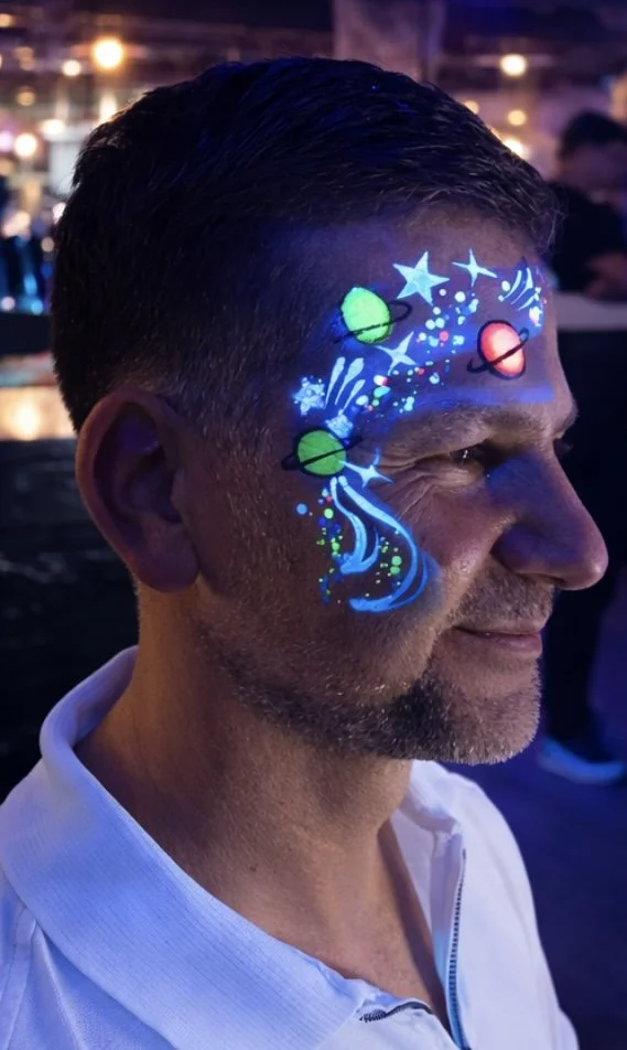 "UV face paint artist in Covent Garden London"