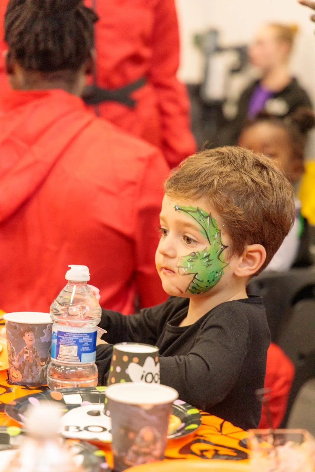 Mobile face painting service for children at a school event in Sutton