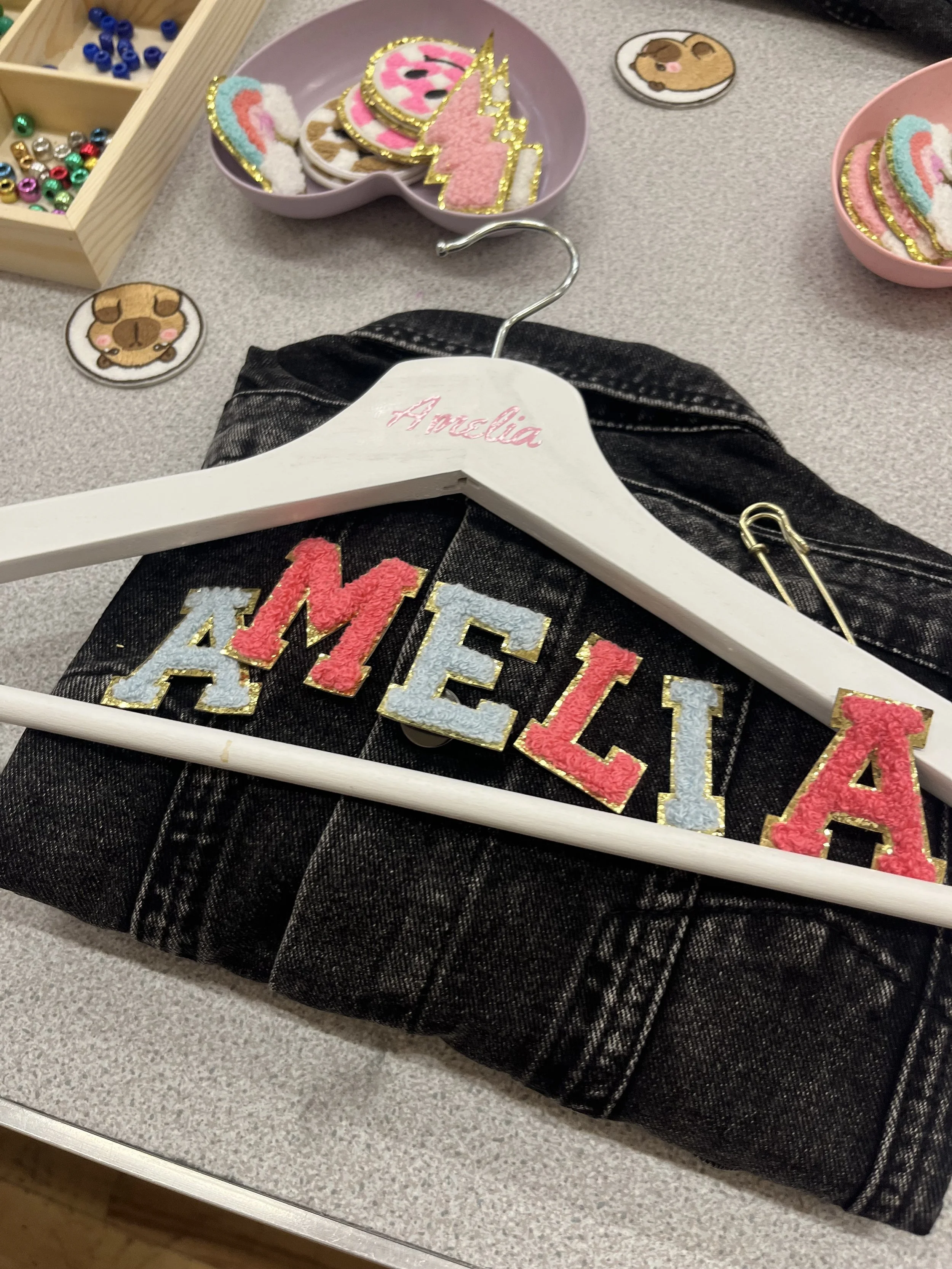 "Guests personalising clothing at an apparel craft party"