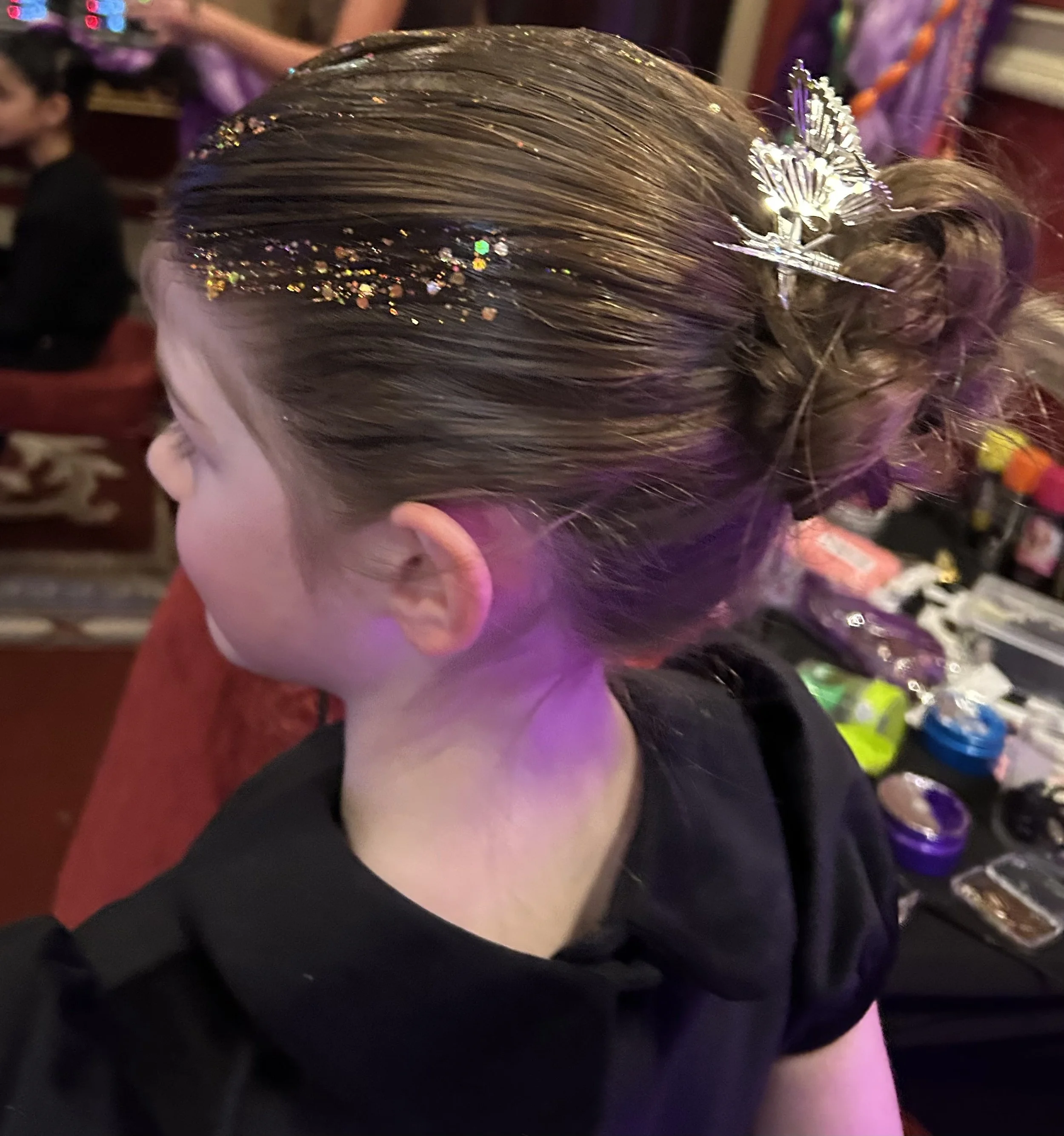 "Children's professional hair styling at South London family event"


