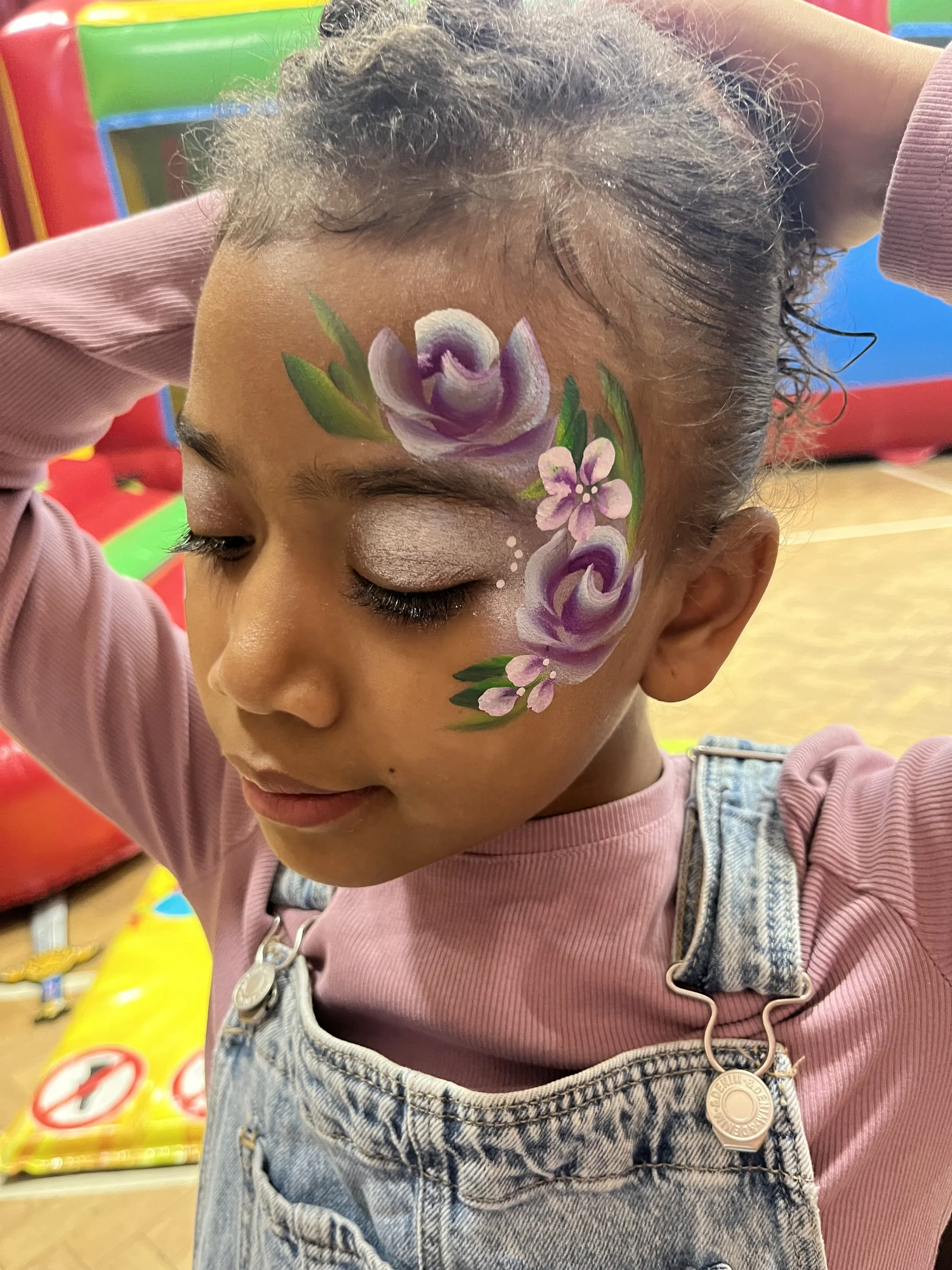 Child having face painting done at a London kids party