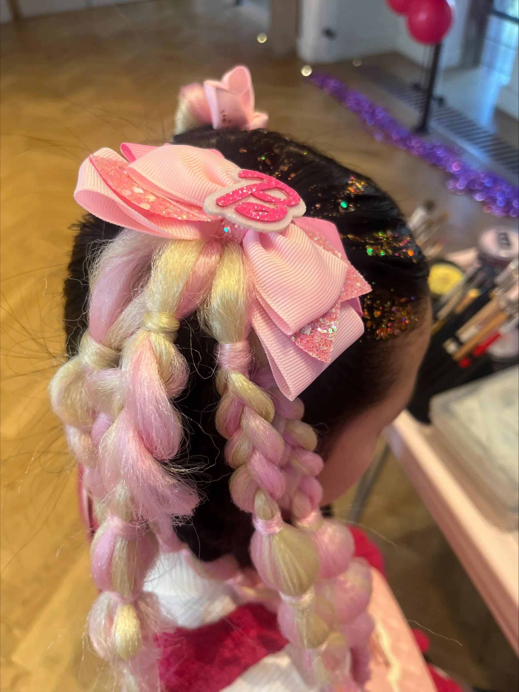 Fun party hair styling for children at a London event