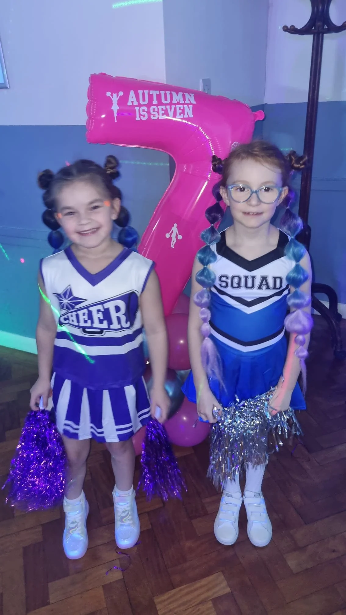 Child with colorful hair accessories styled at South London event