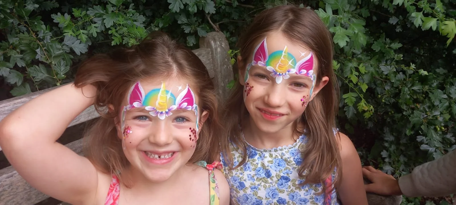 "Professional face painter entertaining children at a Chelsea party"