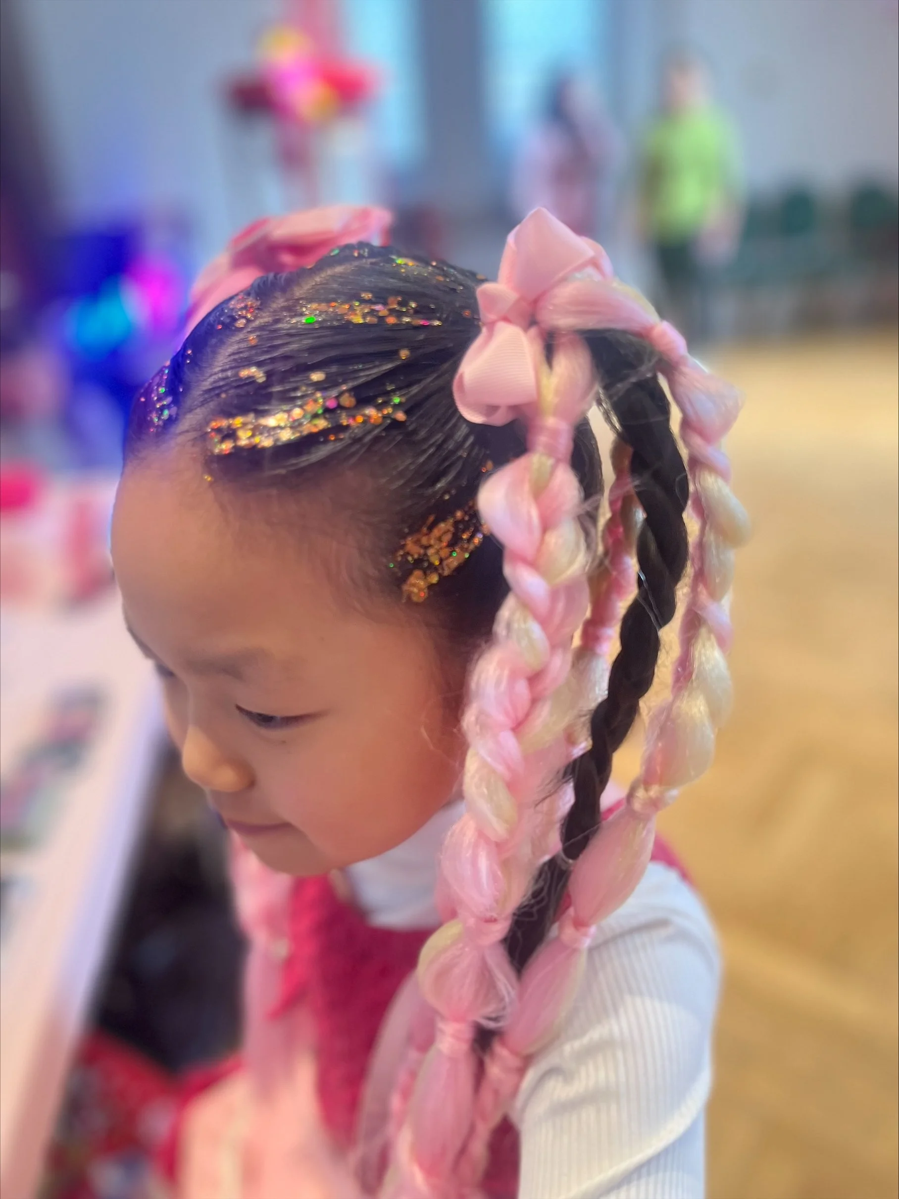 "Hair styling and bubble braids at a London store event"
