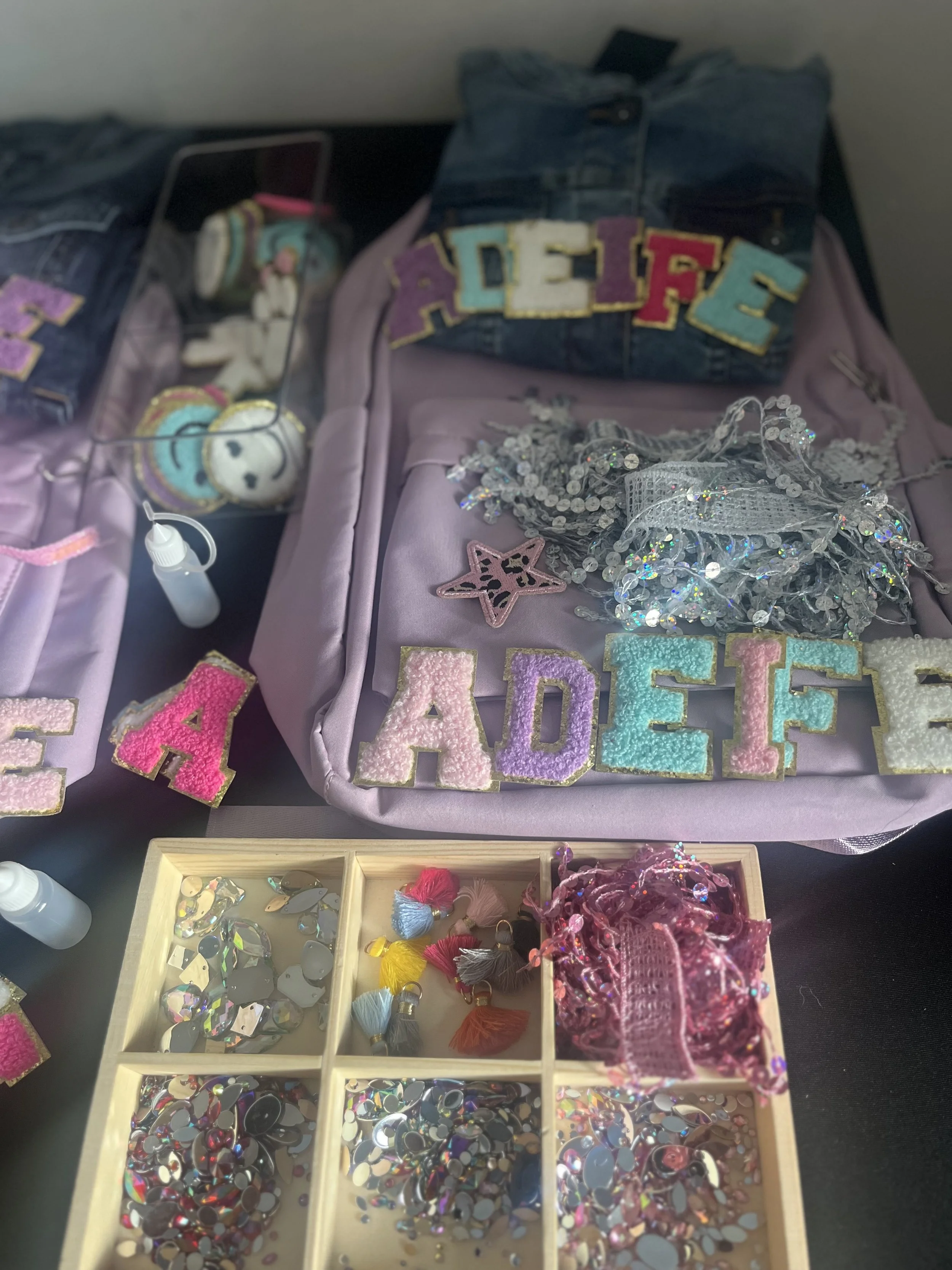 “Children decorating personalised rucksacks at a craft party in Sutton.”
