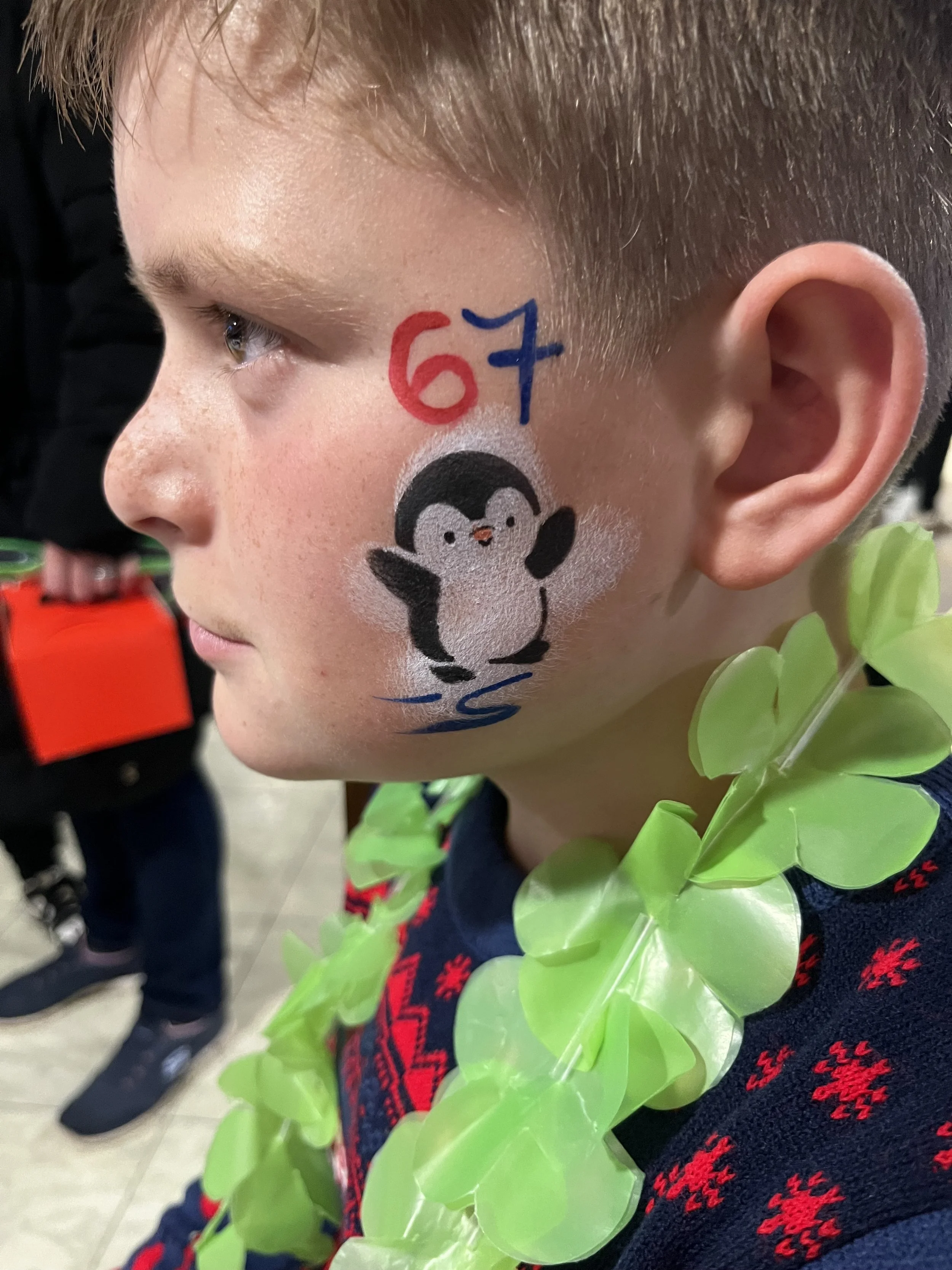 "Professional face painter working at event in South London"