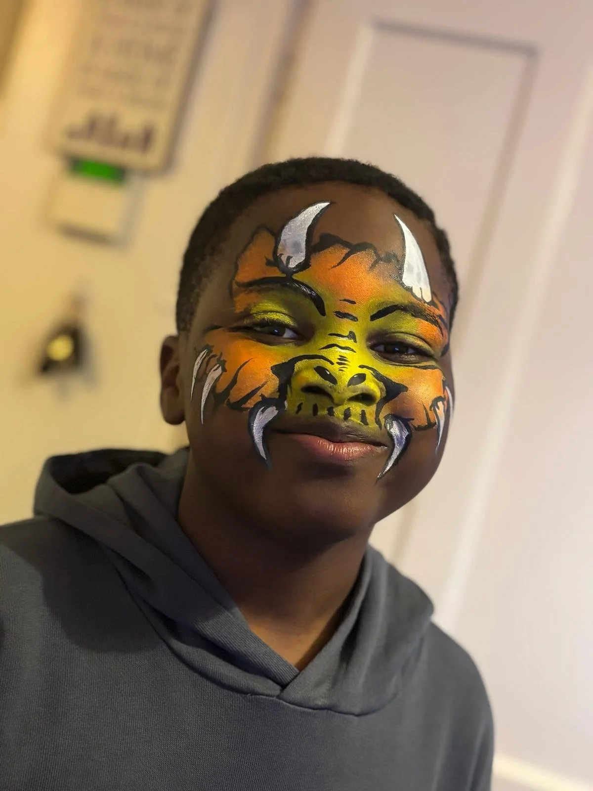 "Glitter face painting station at a Chelsea children’s event"