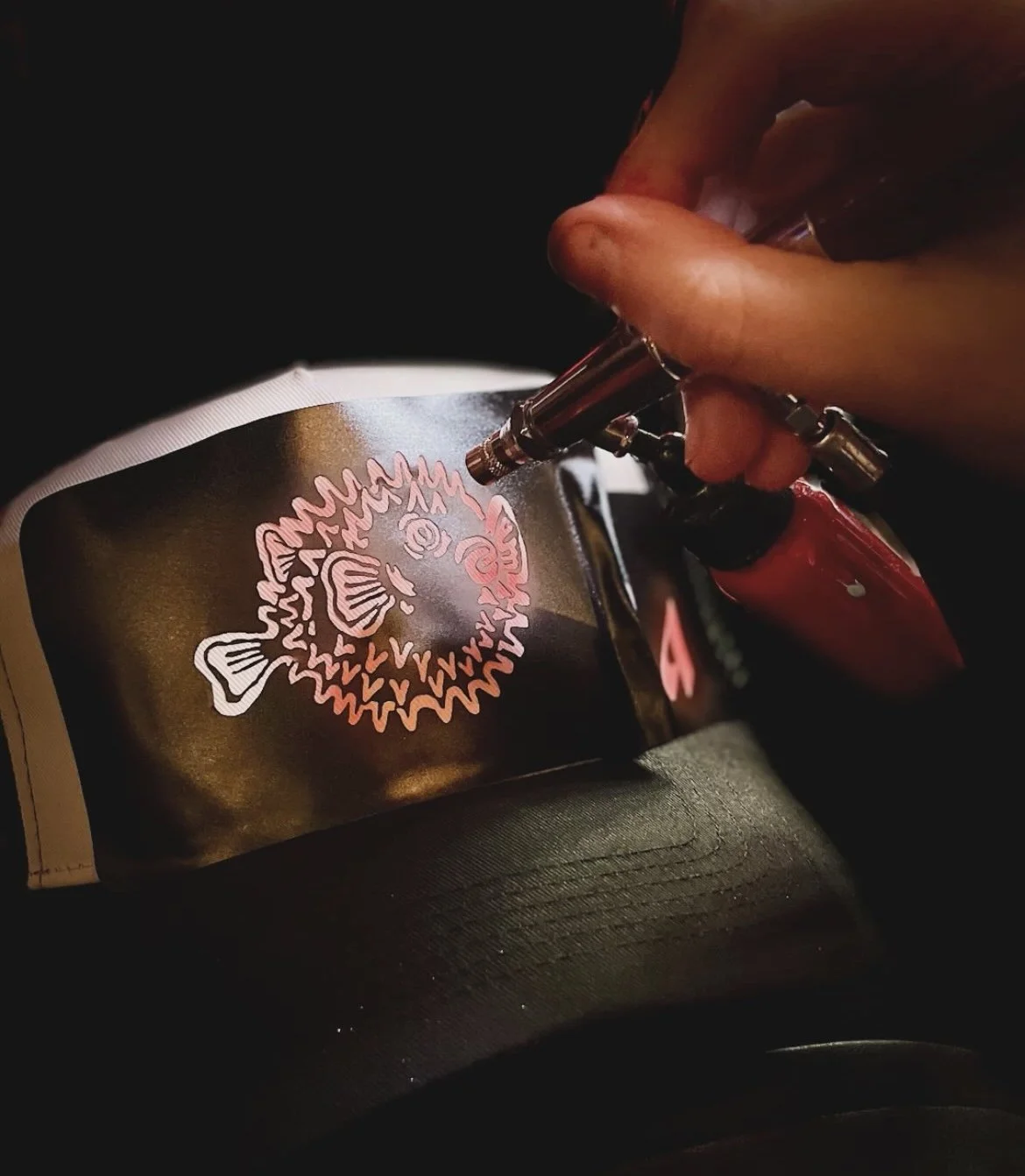 "Custom airbrush apparel station attracting guests at a City of London experiential pop‑up"