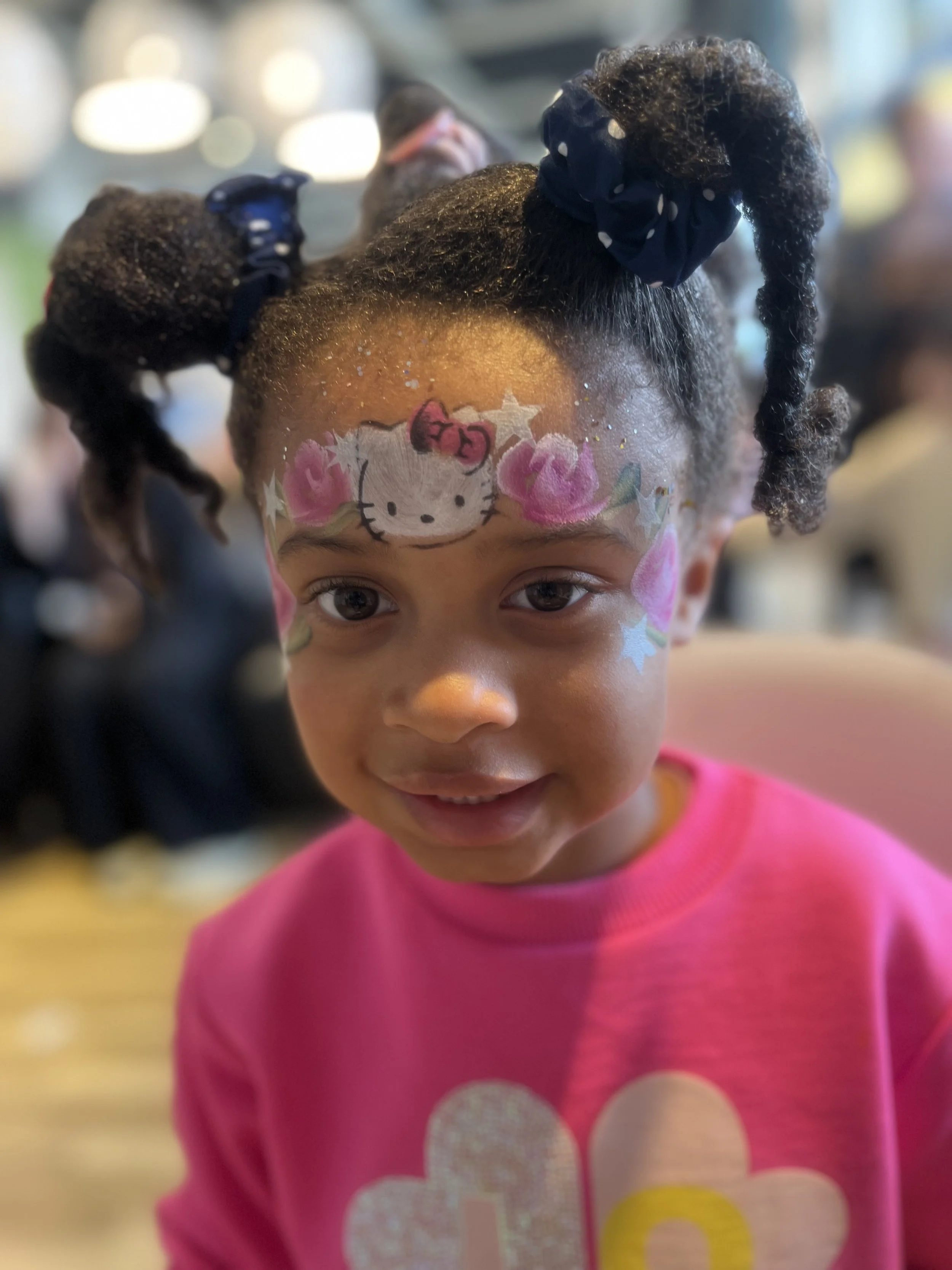 “Children enjoying face painting at Chelsea event”