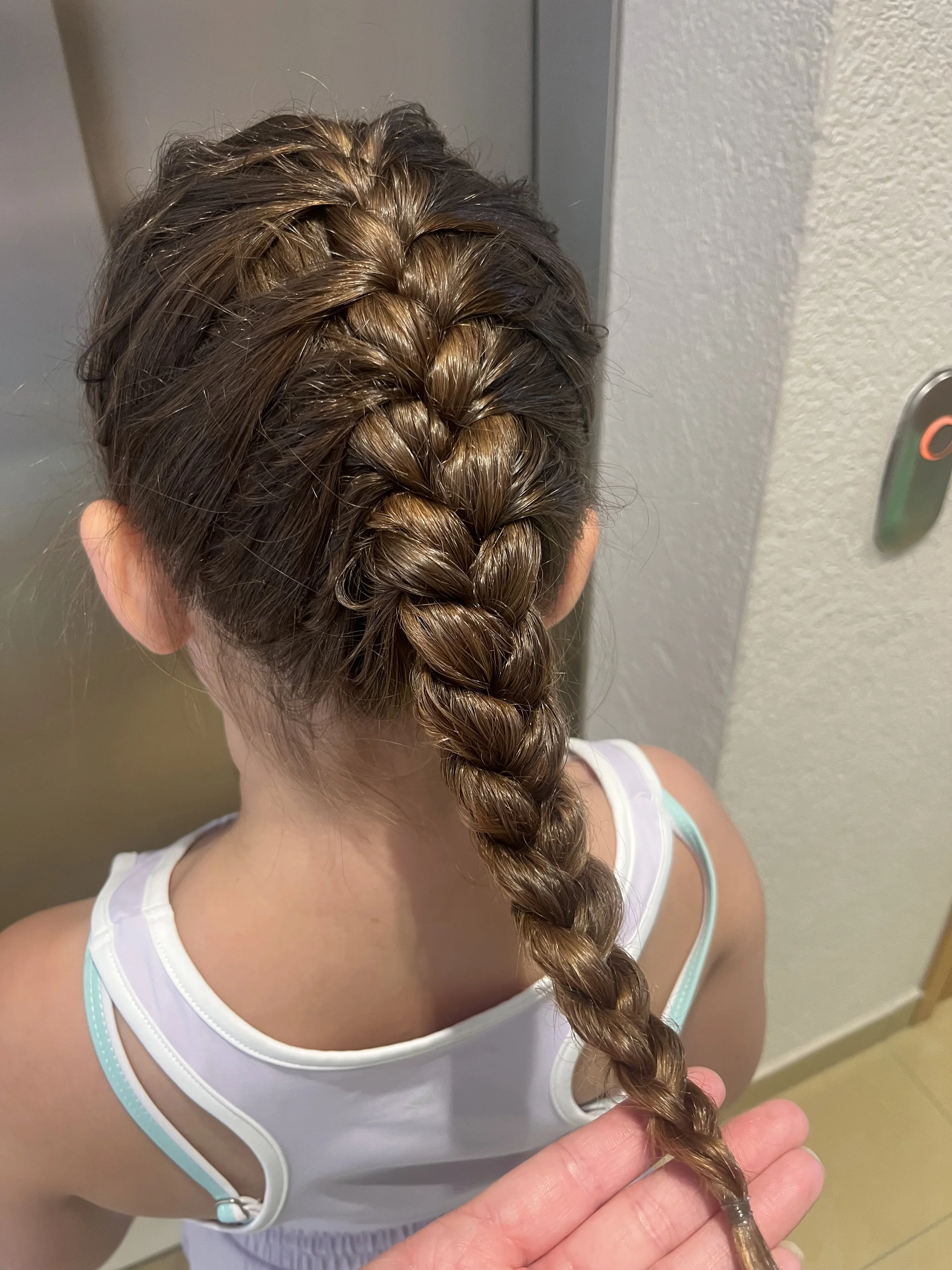 Stylish party hair done for adults at a London workplace celebration