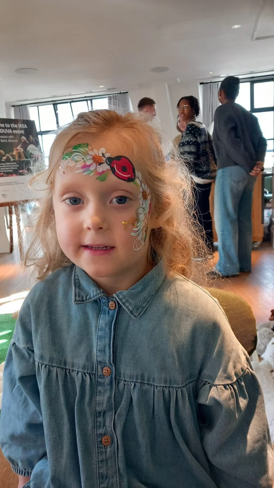 Professional face painter entertaining children at an event in Lambeth