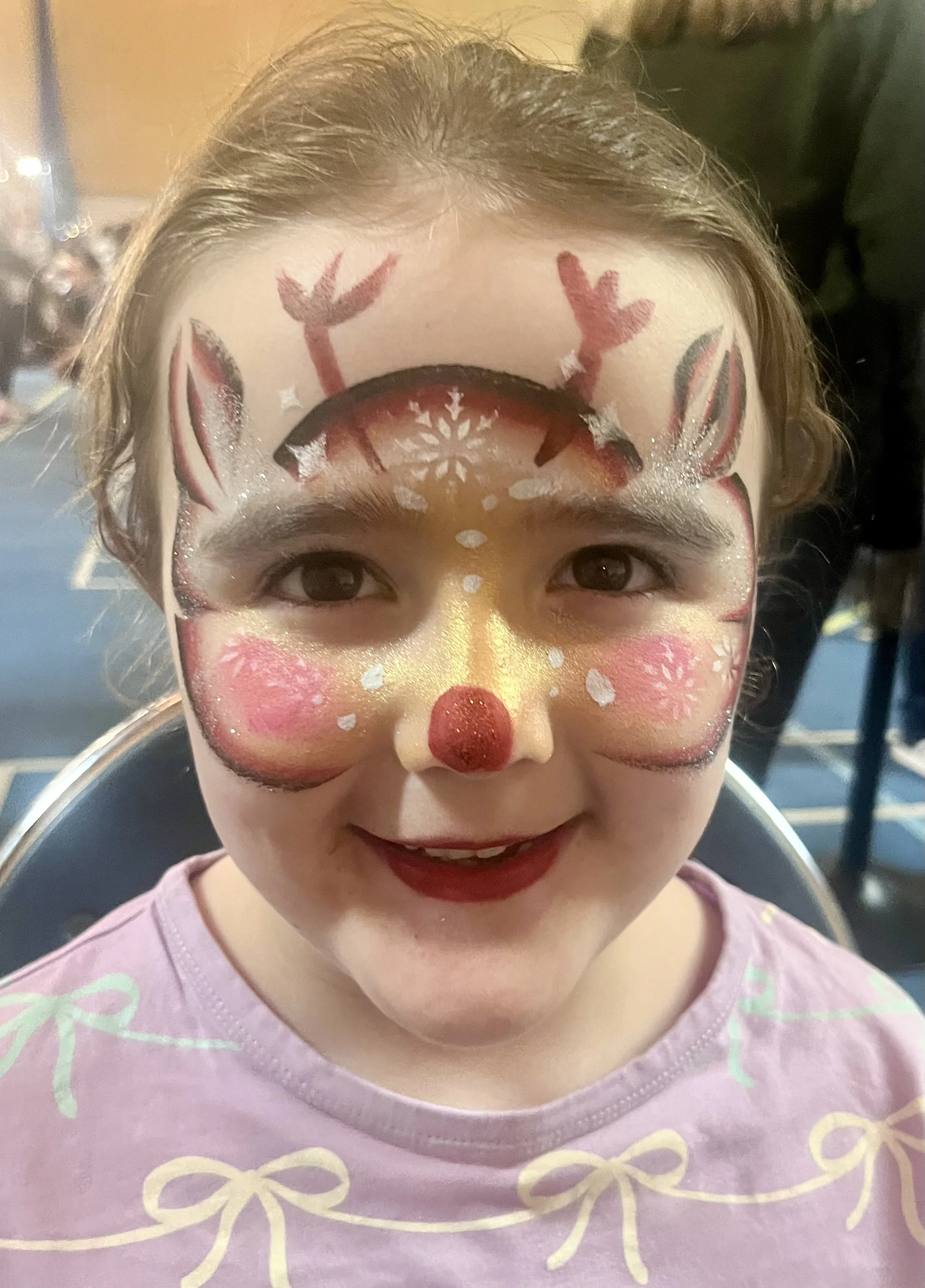 "Festive face painting entertainment at West London corporate Christmas celebration"

