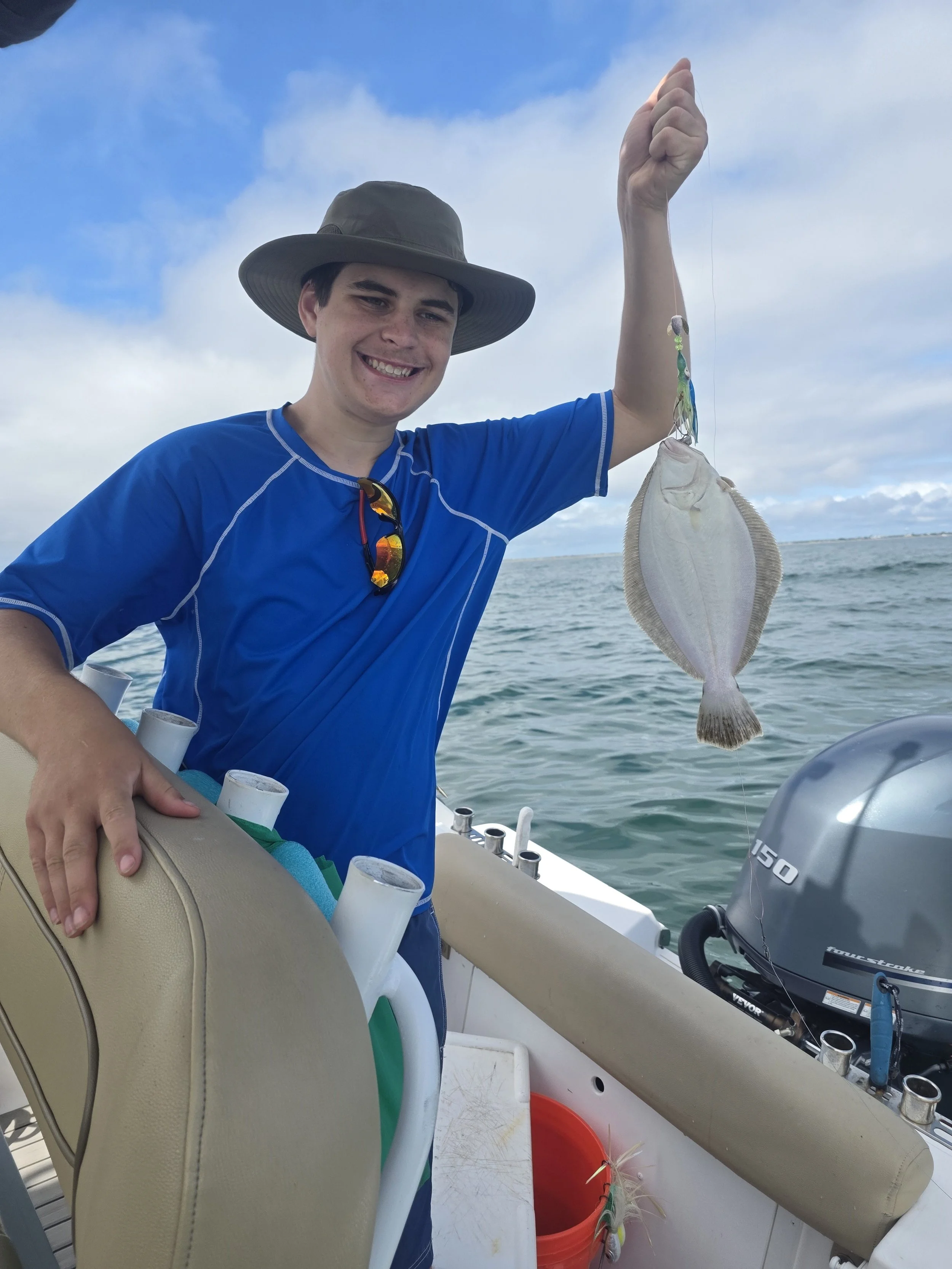 His first ever flounder caught and released