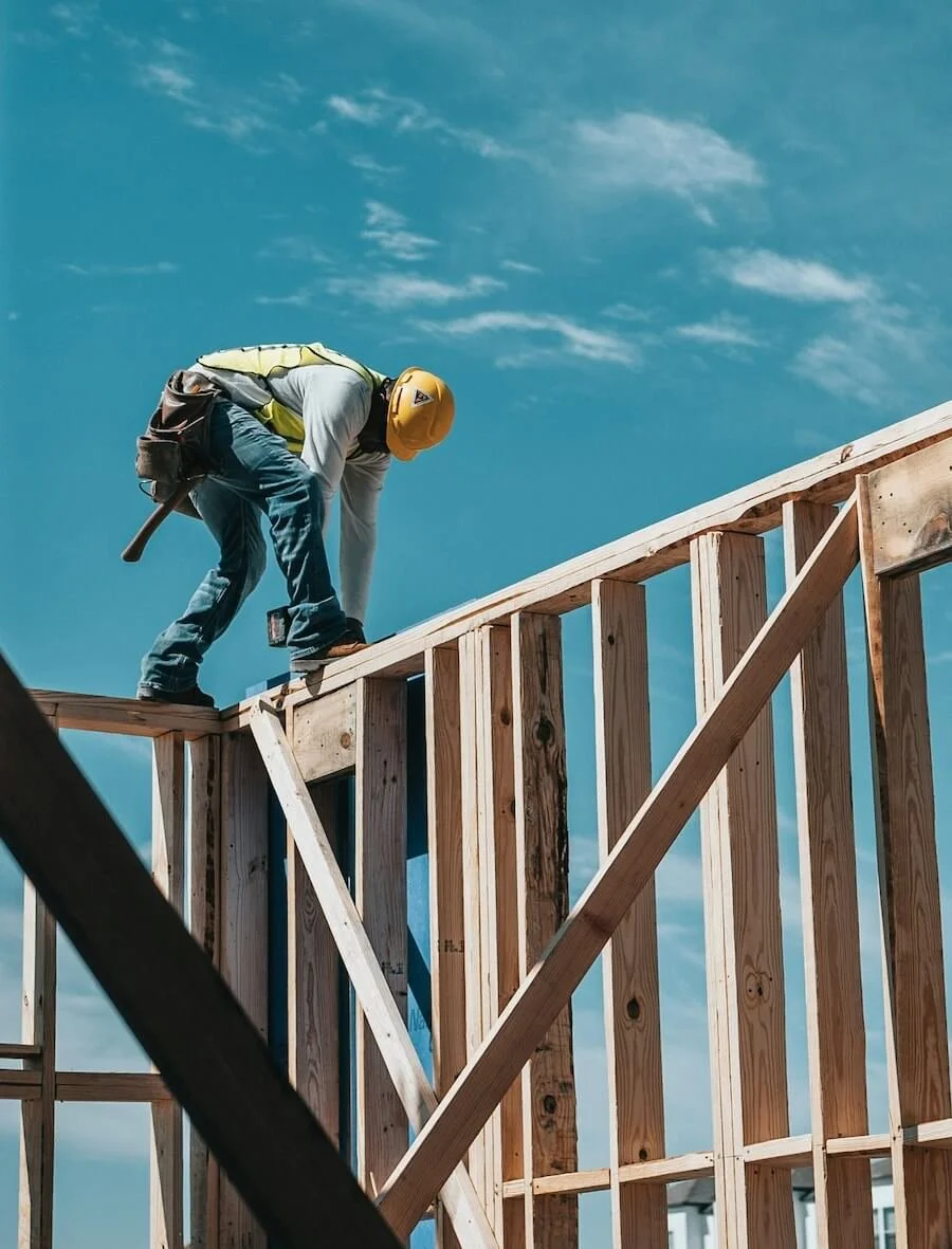 framing contractor working on framing for a home
