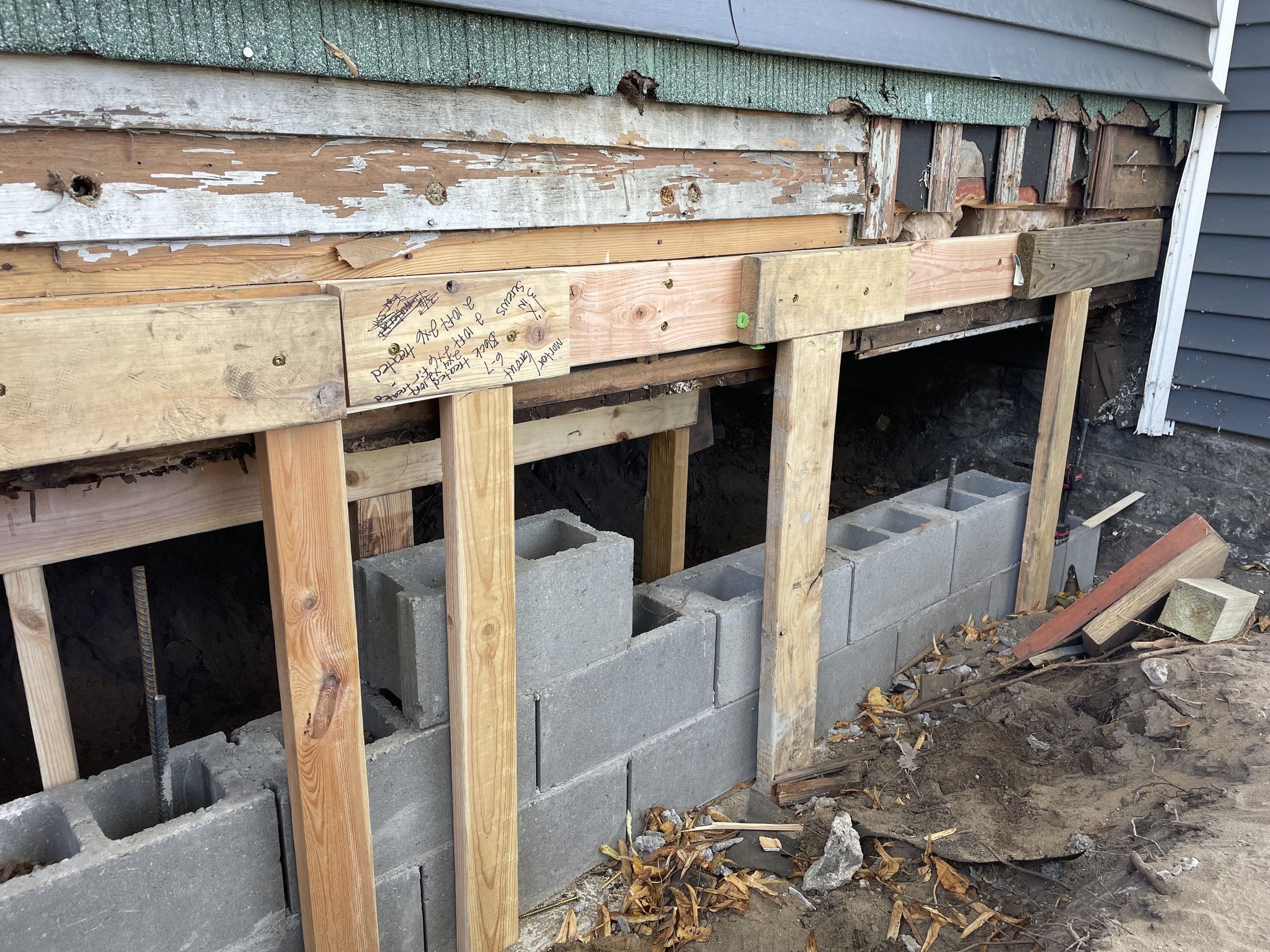 Installing cinderblock foundation.