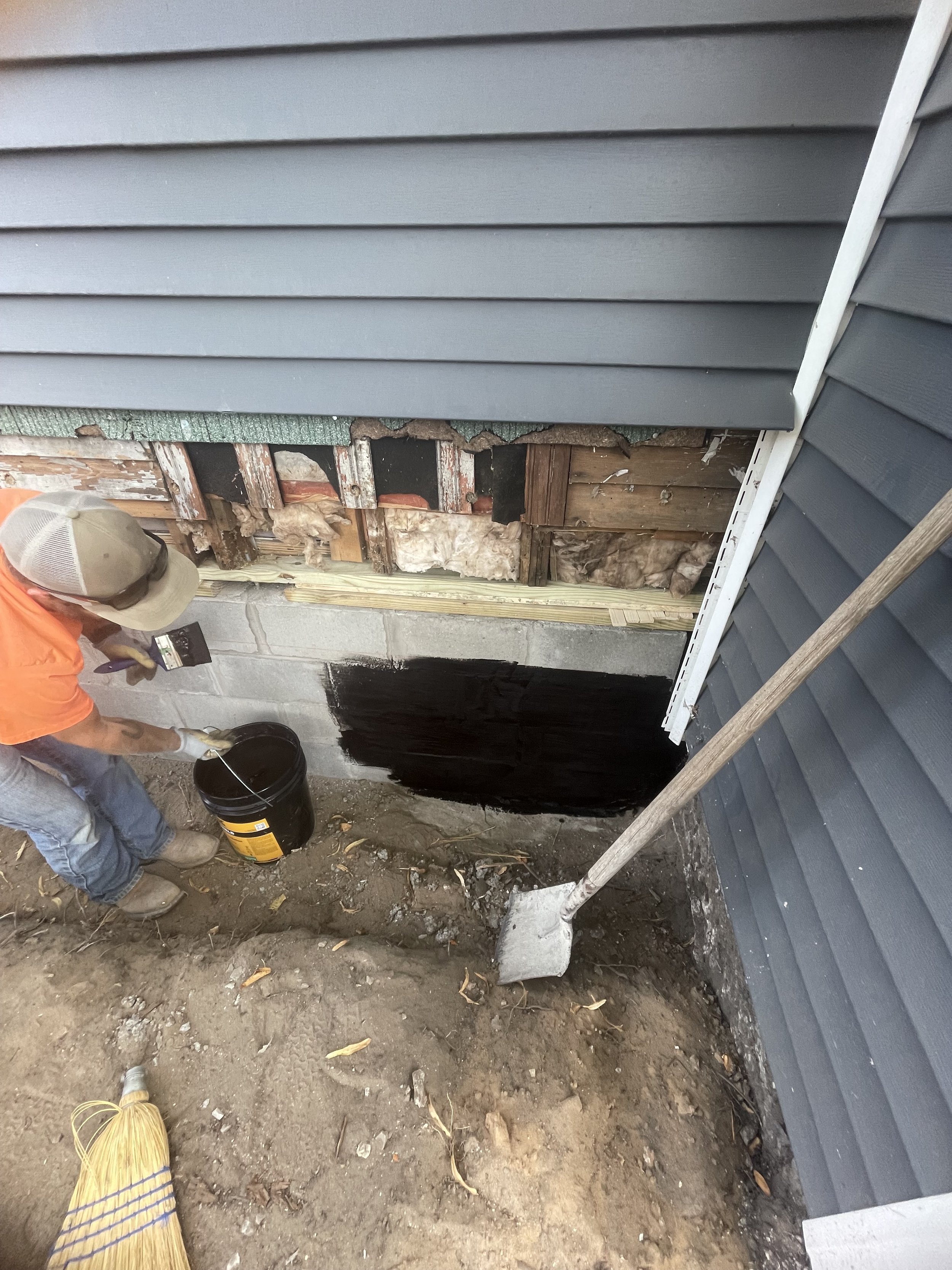 Applying waterproofing.