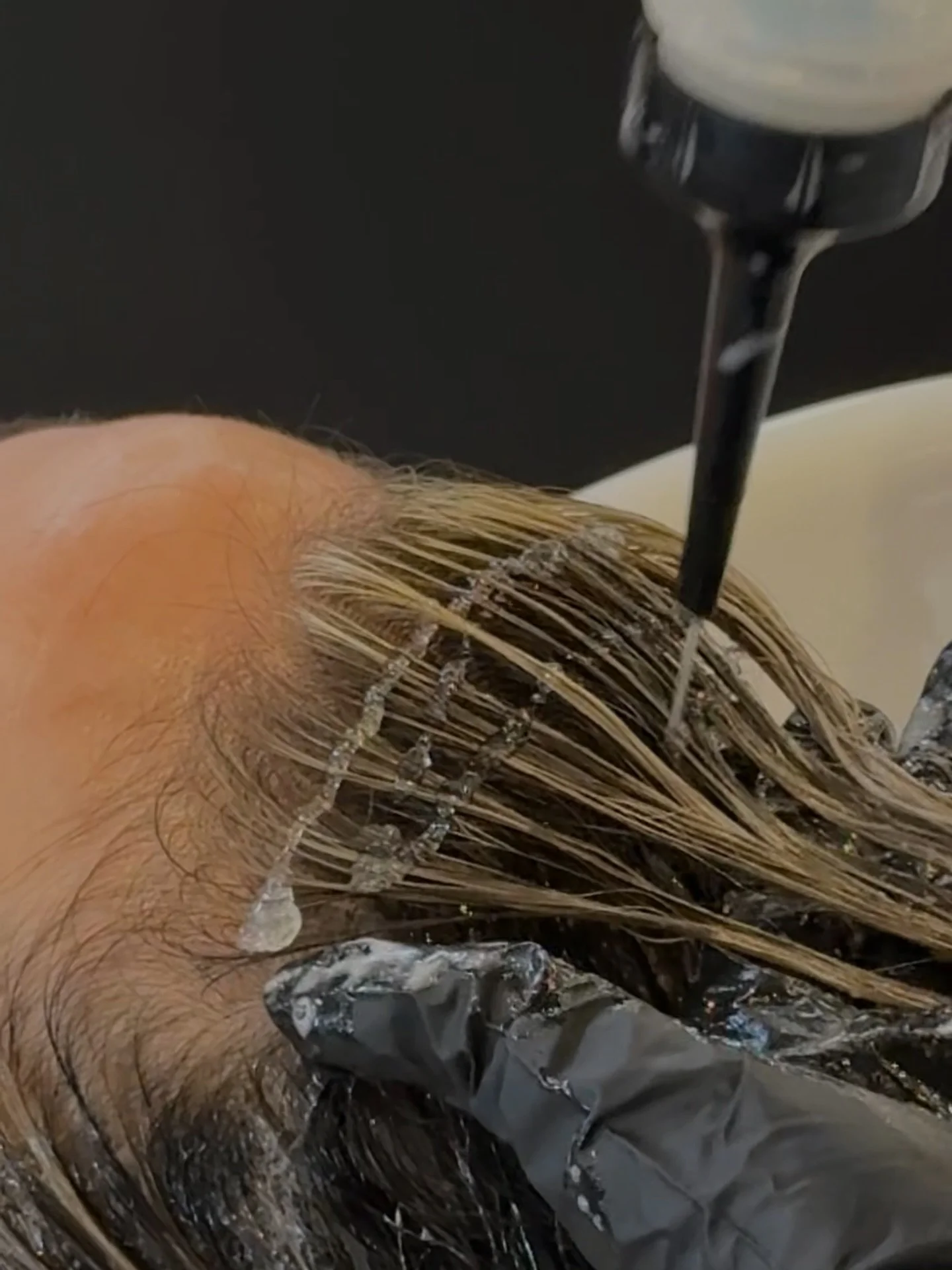 This is the step that determines how your blonde actually looks when you leave.

A gloss (or toner or glaze or whatever you want to call it) isn&rsquo;t just about canceling warmth, it&rsquo;s what refines the tone, adds shine, and brings everything 