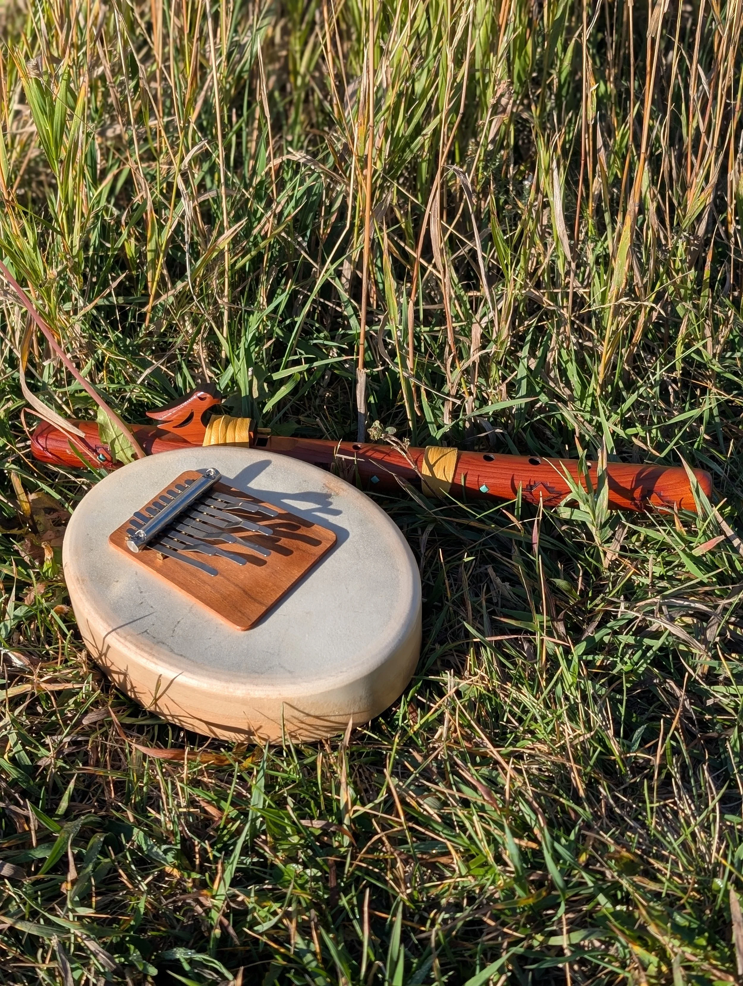 Sansula and flute in grass.jpg