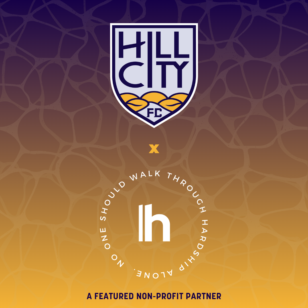 Hills City FC logo at the top, with a purple and yellow background. Text in the middle reads: 'No one should walk through hardshirp alone.' Below is a large white 'h' with a circular arrow around it. At the bottom, it states: 'A featured non-profit p