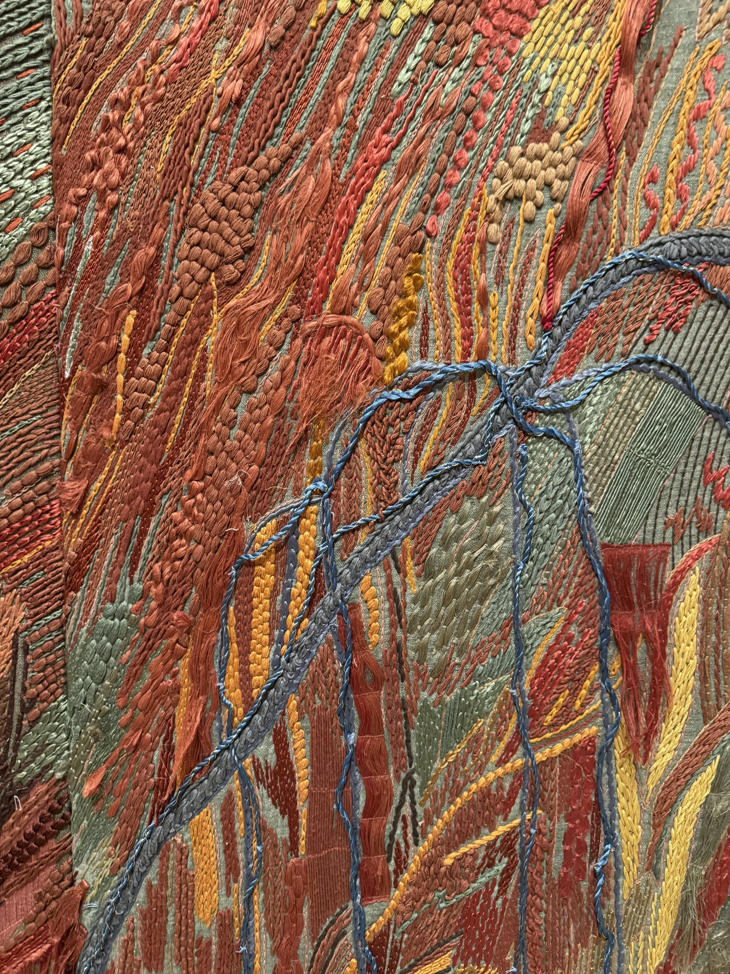 Embroidery wall up close.jpeg