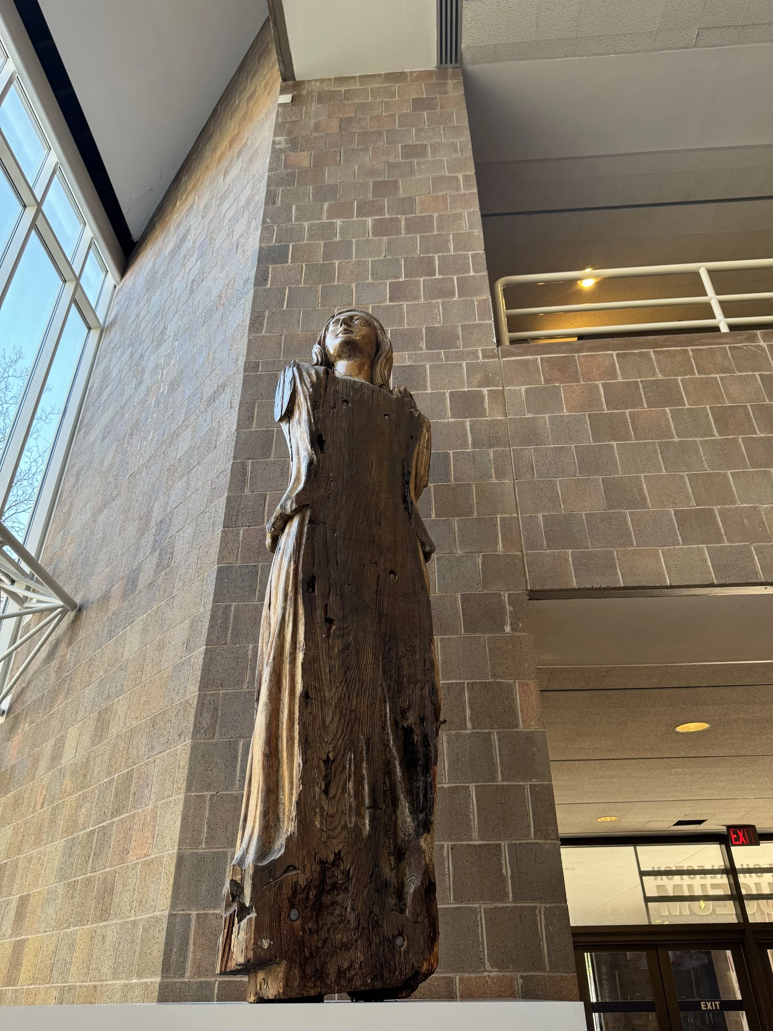 Tall museum wooden statue.jpeg